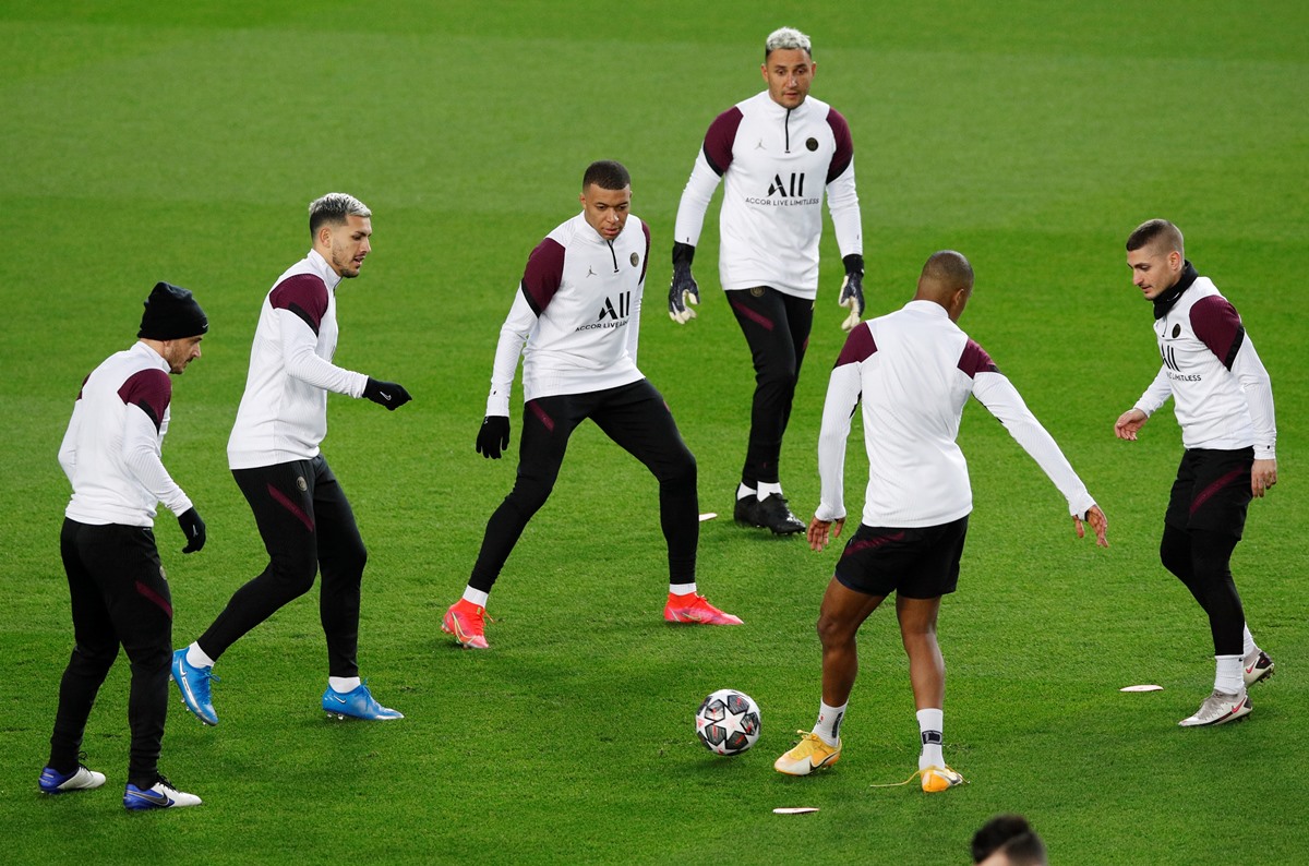 Soccer Football - Champions League - Paris St Germain Training - Camp Nou, Barcelona, Spain - February 15, 2021 Paris St Germain's Kylian Mbappe, Keylor Navas, Marco Verratti and teammates during training REUTERS