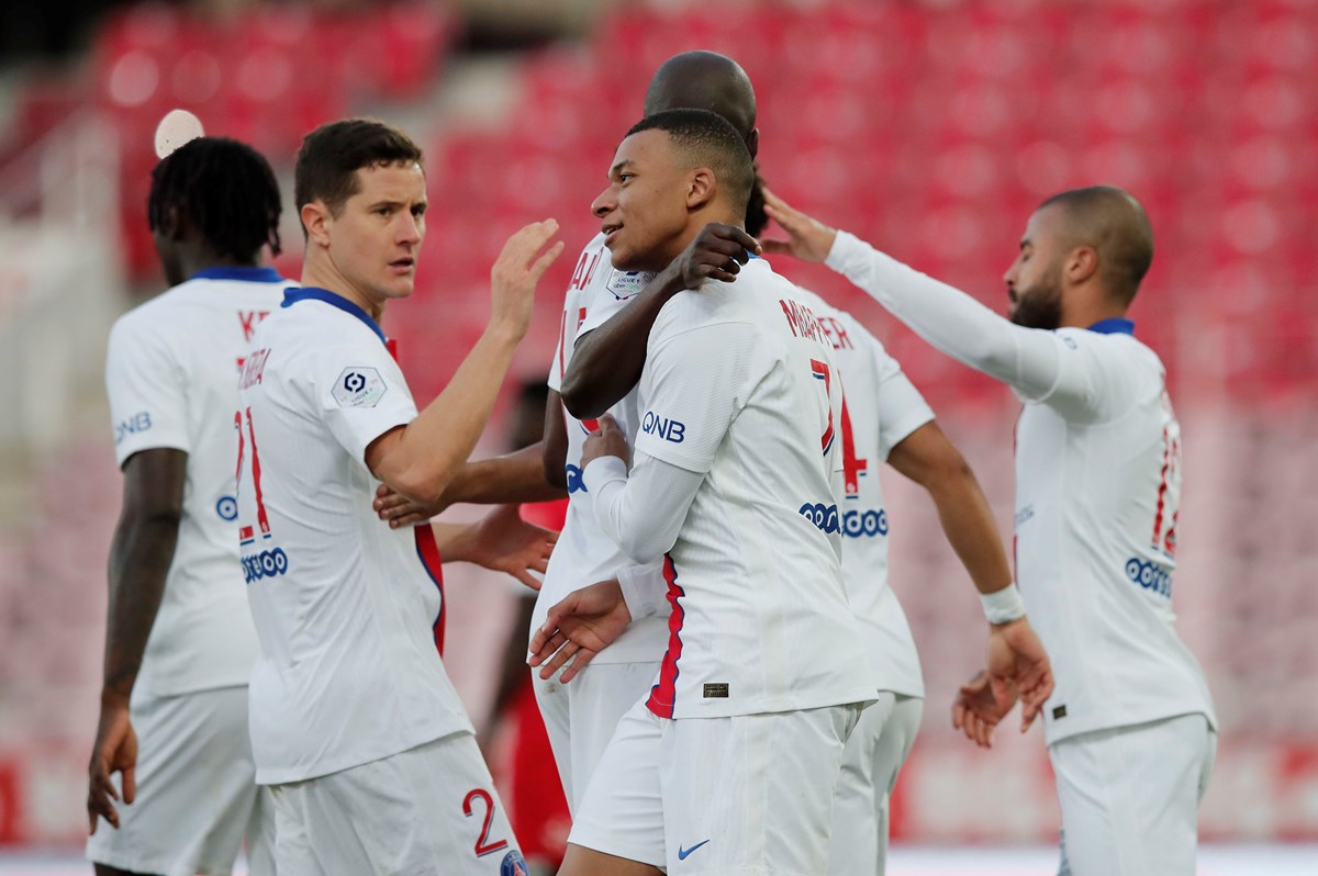 Soccer Football - Ligue 1 - Dijon v Paris St Germain - Stade Gaston Gerard, Dijon, France - February 27, 2021 Paris St Germain's Kylian Mbappe celebrates scoring their third goal with teammates REUTERS