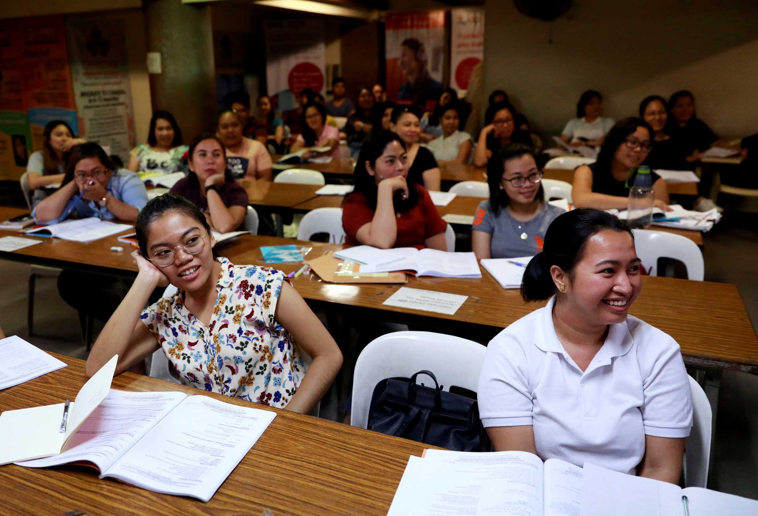 FILE PHOTO: Filipino workers, including nurses applying to work in United Kingdom, attend a lecture at a review center for the International English Language Testing System or IELTS in Manila, Philippines, April 2, 2019. Picture taken April 2, 2019. REUTERS
