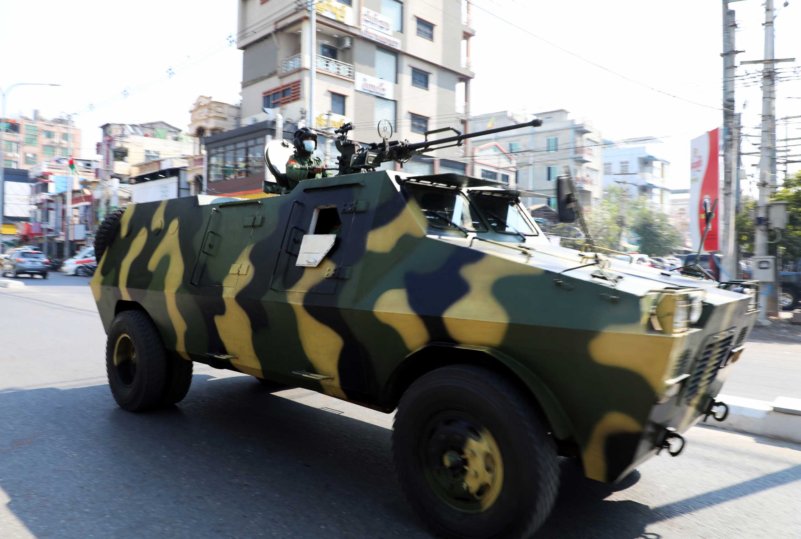Myanmar Army armored vehicles drive in a street after the military seized power in a coup in Mandalay, Myanmar February 3, 2021. REUTERS