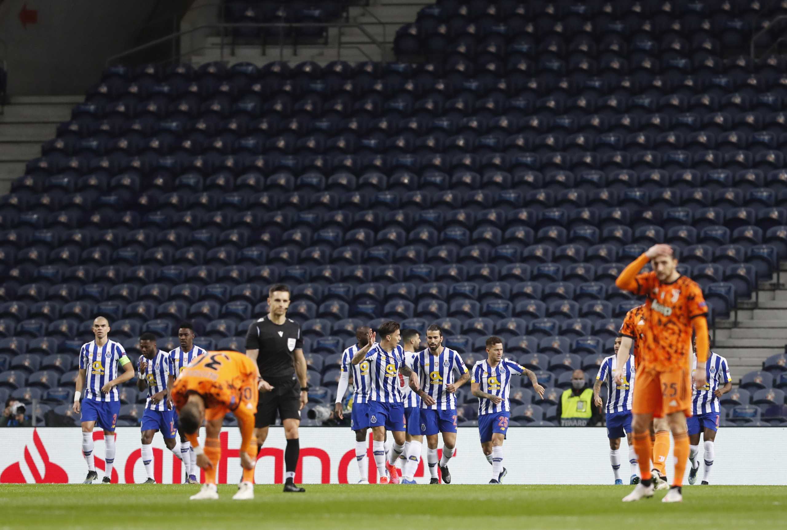 Soccer Football- Champions League - Round of 16 First Leg - FC Porto v Juventus - Estadio do Dragao, Porto, Portugal - February 17, 2021 FC Porto's Mehdi Taremi celebrates scoring their first goal with teammates REUTERS