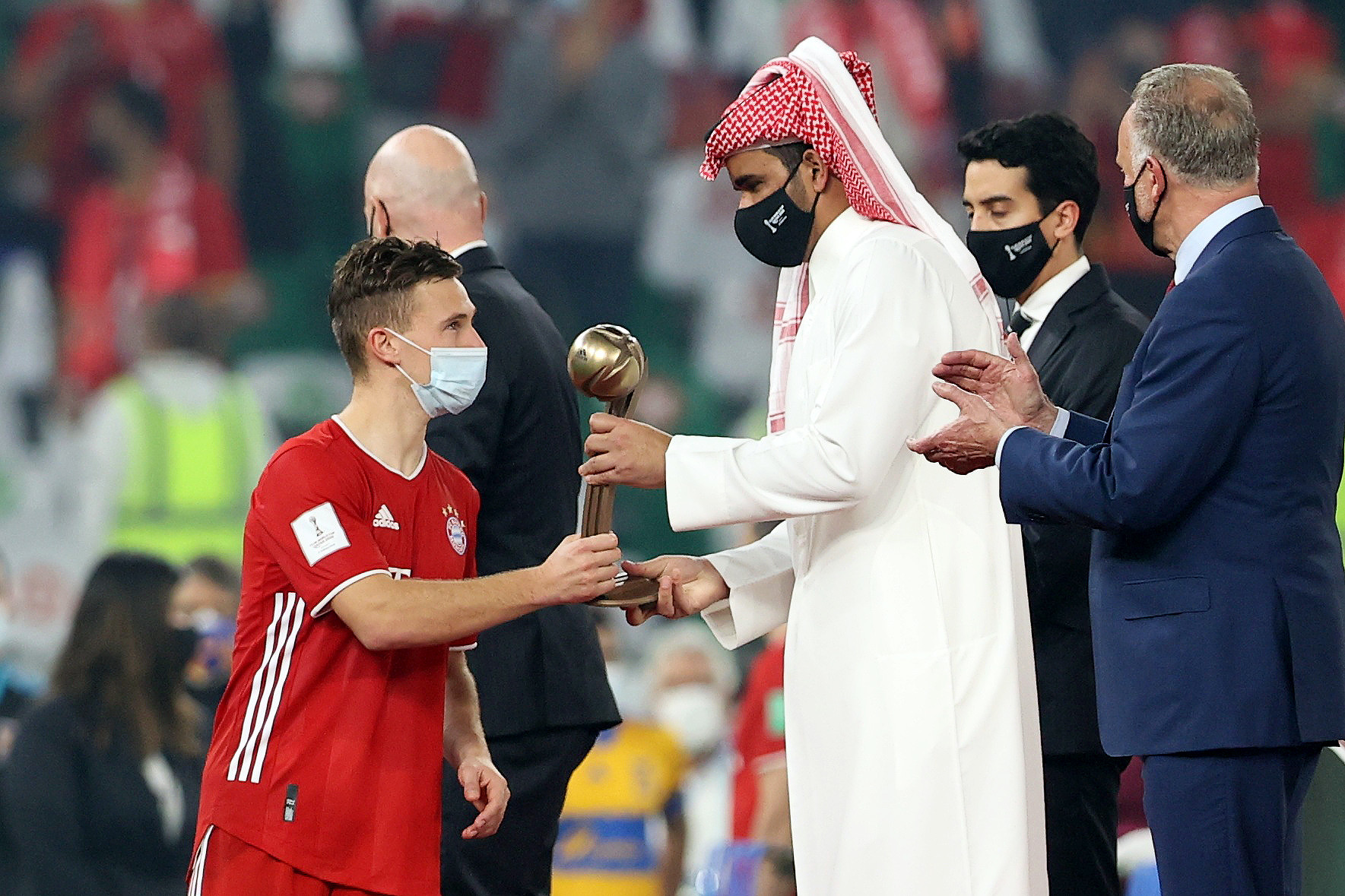 Soccer Football - Club World Cup - Final - Bayern Munich v Tigres UANL - Education City Stadium, Al Rayyan, Qatar - February 11, 2021 Bayern Munich's Joshua Kimmich with the bronze ball trophy REUTERS