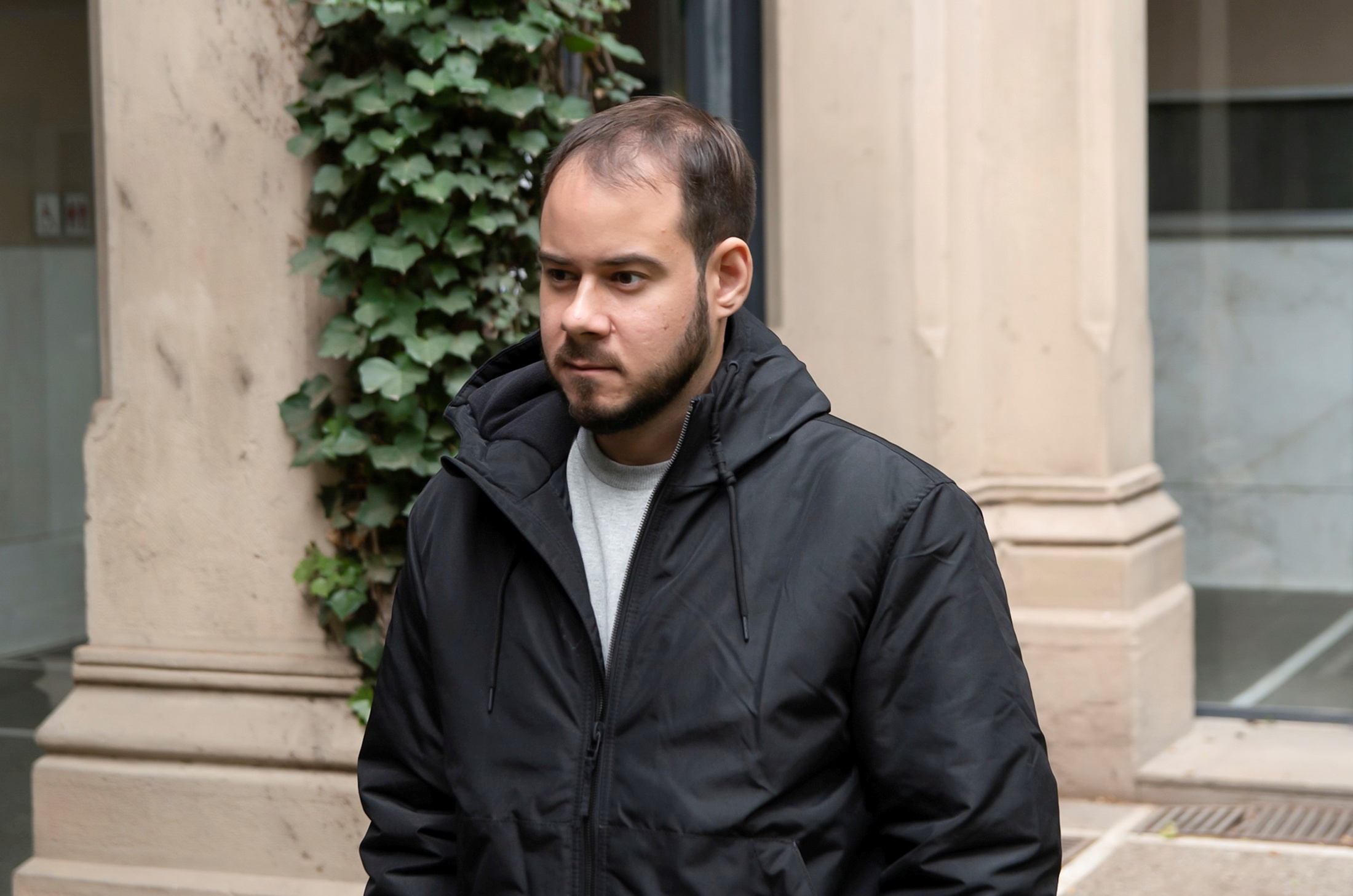 Catalan rap singer Pablo Hasel looks on at the University of Lleida rectory, after he was sentenced to jail time on charges of glorifying terrorism and insulting the Spanish Crown and state institutions, during the coronavirus disease (COVID-19) outbreak, in Lleida, Spain February 15, 2021. REUTERS