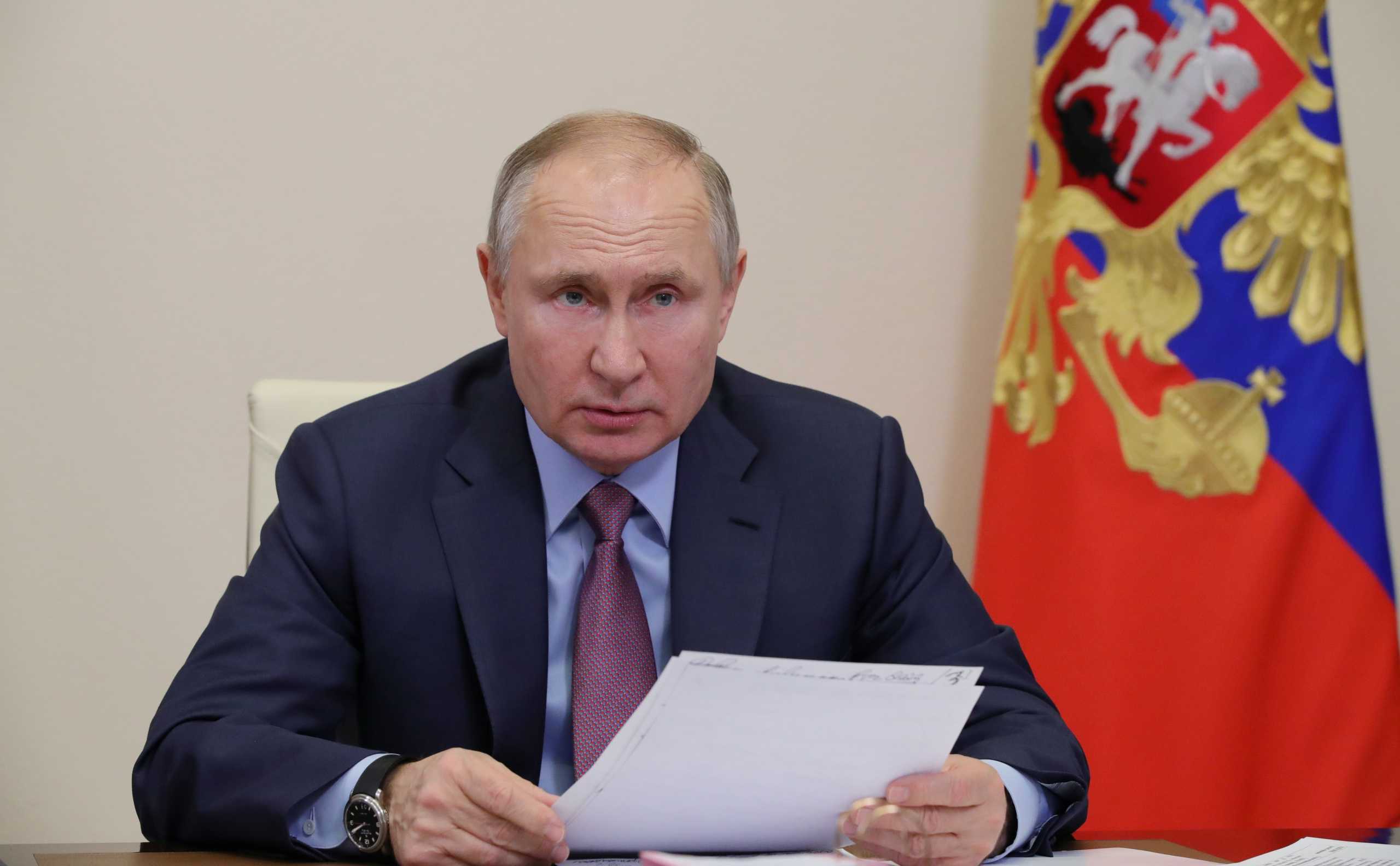 Russian President Vladimir Putin chairs a meeting with government members via a video conference call at Novo-Ogaryovo state residence outside Moscow, Russia February 10, 2021. Sputnik