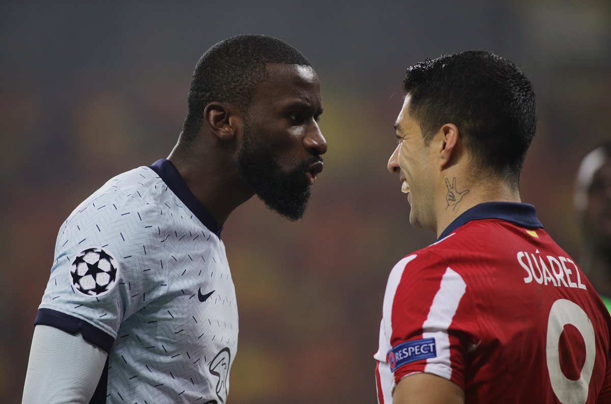 Soccer Football - Champions League - Round of 16 First Leg - Atletico Madrid v Chelsea - Arena Nationala, Bucharest, Romania - February 23, 2021 Chelsea's Antonio Rudiger clashes with Atletico Madrid's Luis Suarez Inquam Photos via REUTERS