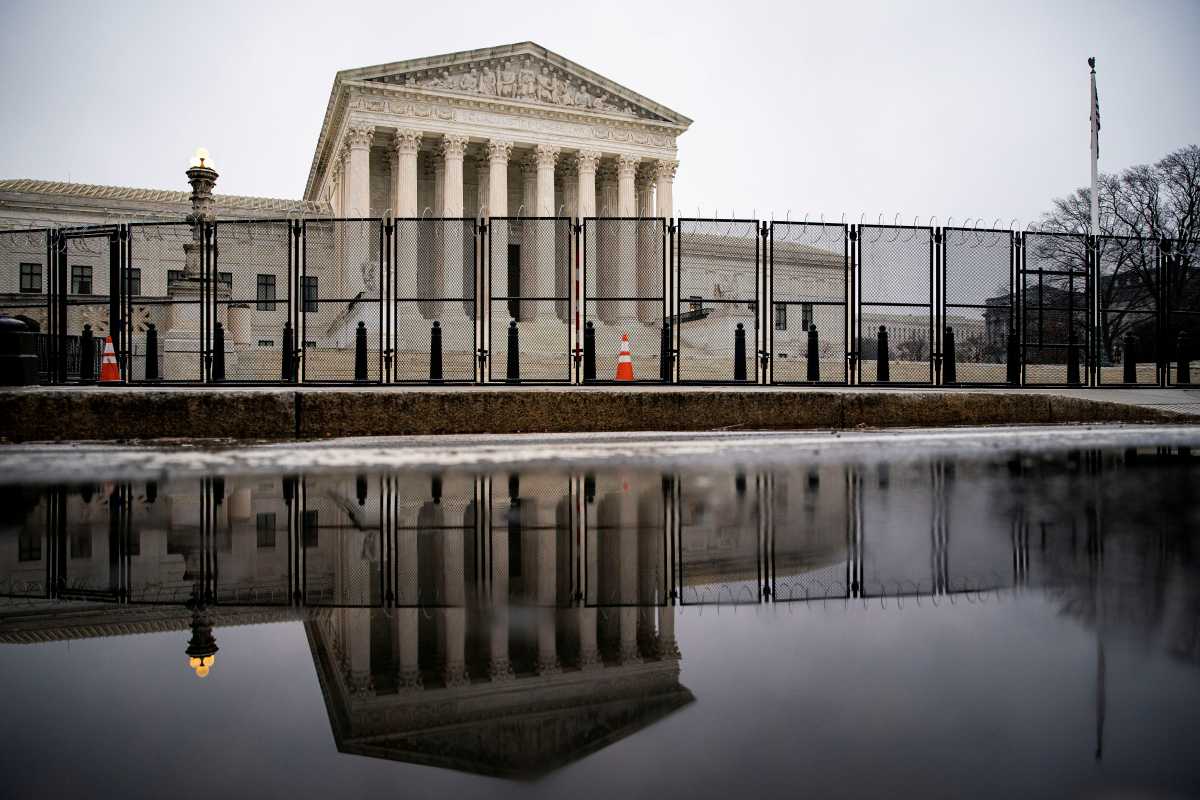 FILE PHOTO: Barbed wire and security fencing surrounds the U.S. Supreme Court in Washington, U.S., January 26, 2021. REUTERS