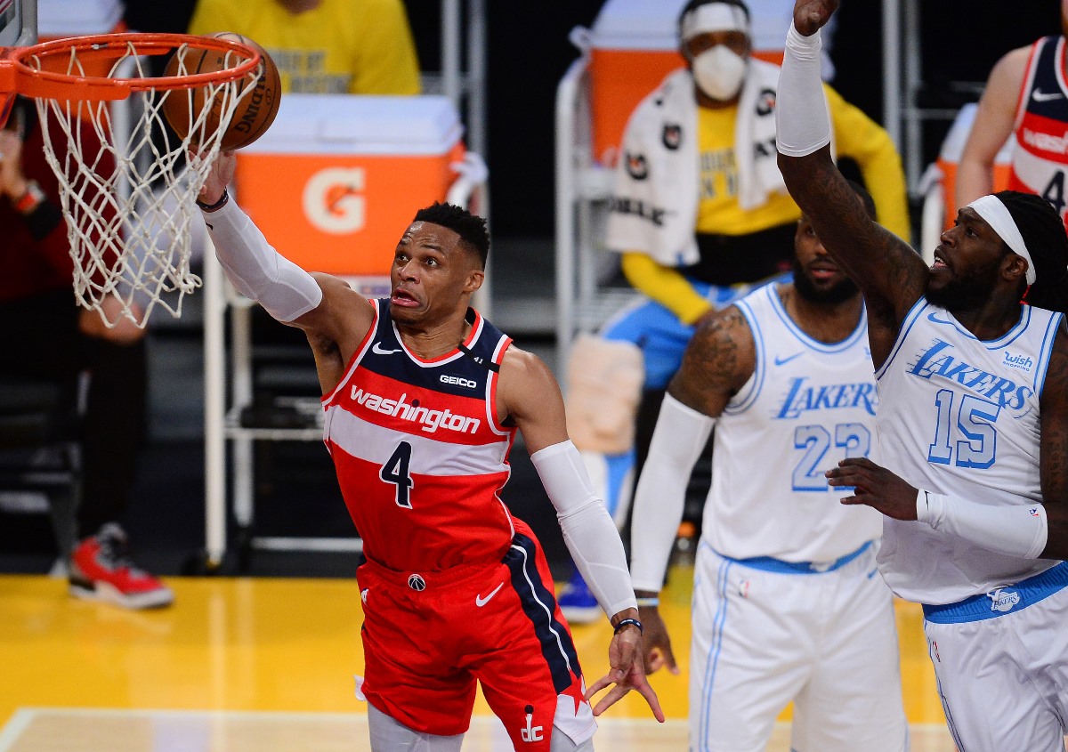 Feb 22, 2021; Los Angeles, California, USA; Washington Wizards guard Russell Westbrook (4) moves to the basket against Los Angeles Lakers center Montrezl Harrell (15) during the second half at Staples Center. Mandatory Credit: Gary A. Vasquez-USA TODAY Sports