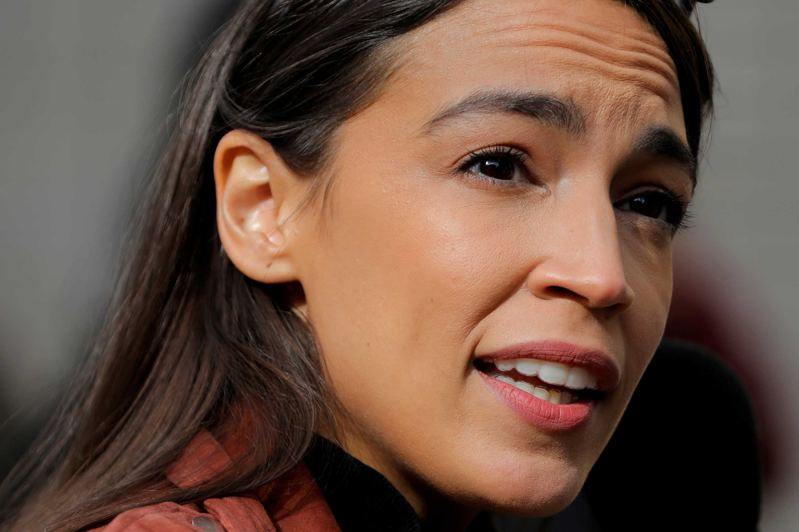 FILE PHOTO: Congresswoman Alexandria Ocasio-Cortez addresses media as she arrives to vote early at a polling station in The Bronx, New York City, U.S., October 25, 2020. REUTERS