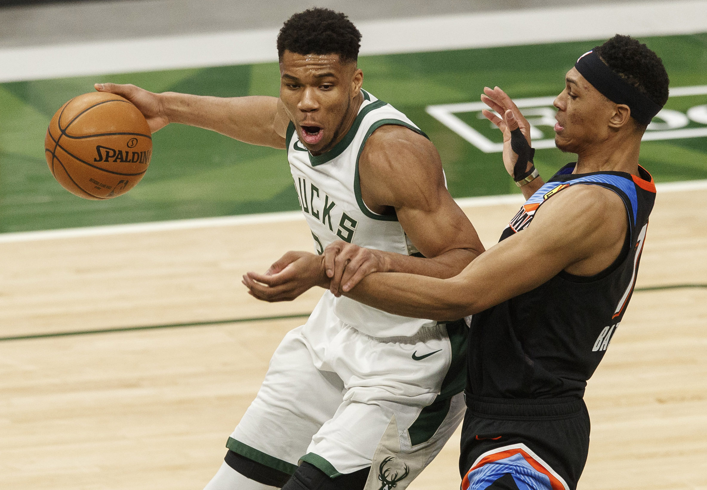Feb 19, 2021; Milwaukee, Wisconsin, USA;  Milwaukee Bucks forward Giannis Antetokounmpo (34) drives for the basket as Oklahoma City Thunder forward Darius Bazley (7) defends during the third quarter at Fiserv Forum. Mandatory Credit: Jeff Hanisch-USA TODAY Sports