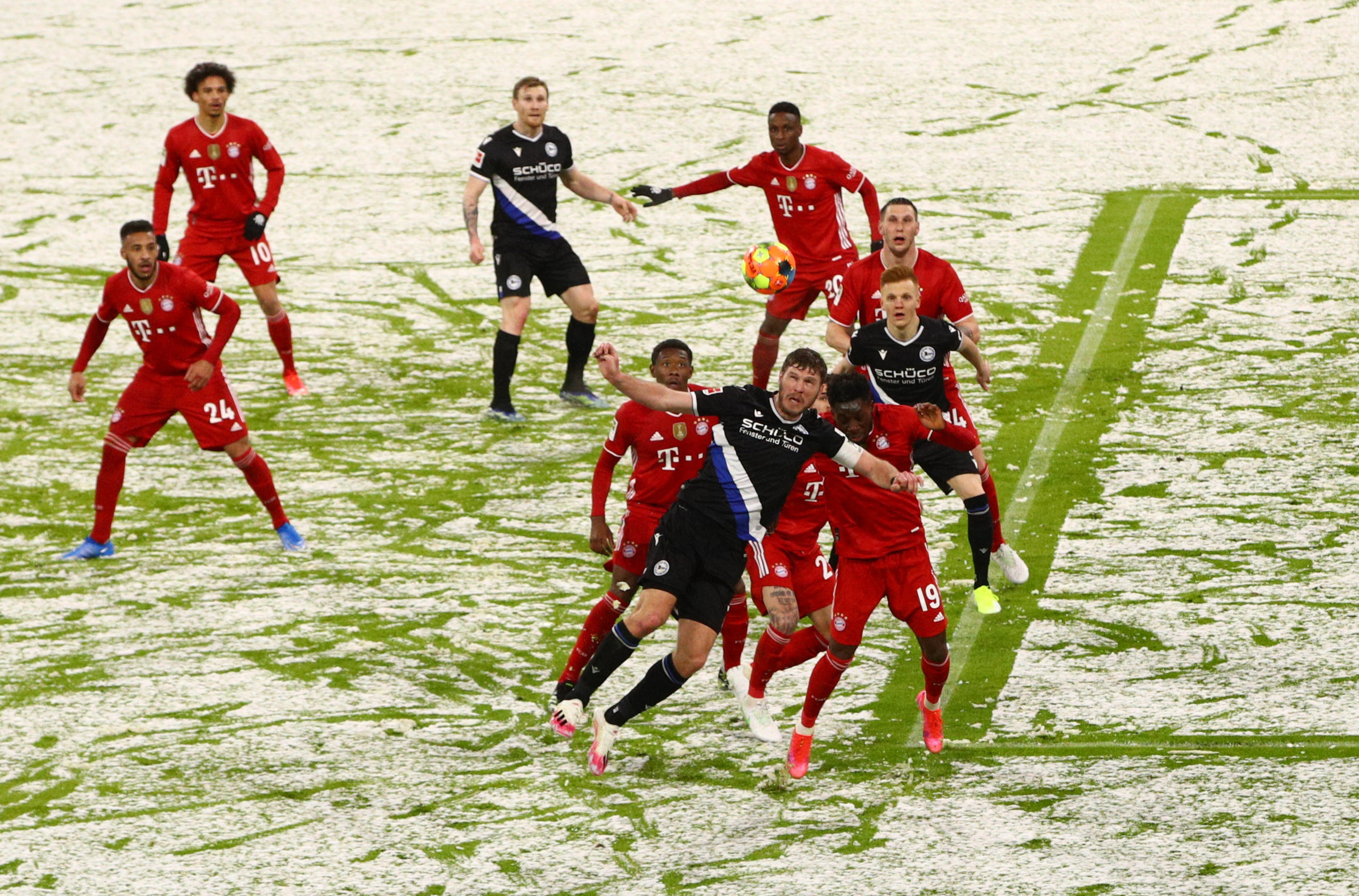 Soccer Football - Bundesliga - Bayern Munich v Arminia Bielefeld - Allianz Arena, Munich, Germany - February 15, 2021 Arminia Bielefeld's Fabian Klos in action with Bayern Munich's Alphonso Davies Pool via REUTERS