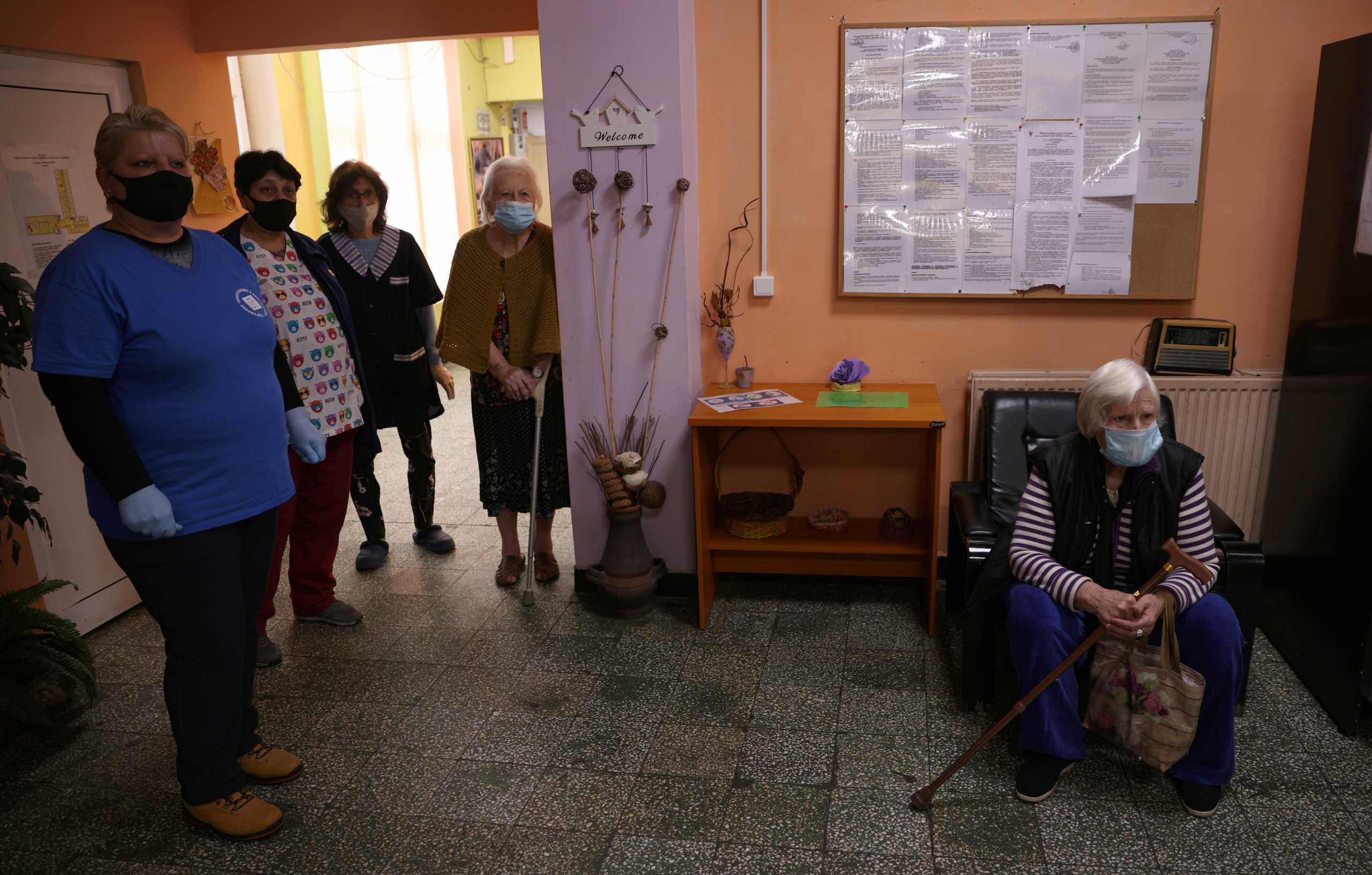 A woman waits to receive a coronavirus disease (COVID-19) vaccine at a care home in Sofia, Bulgaria, January 27, 2021. REUTERS
