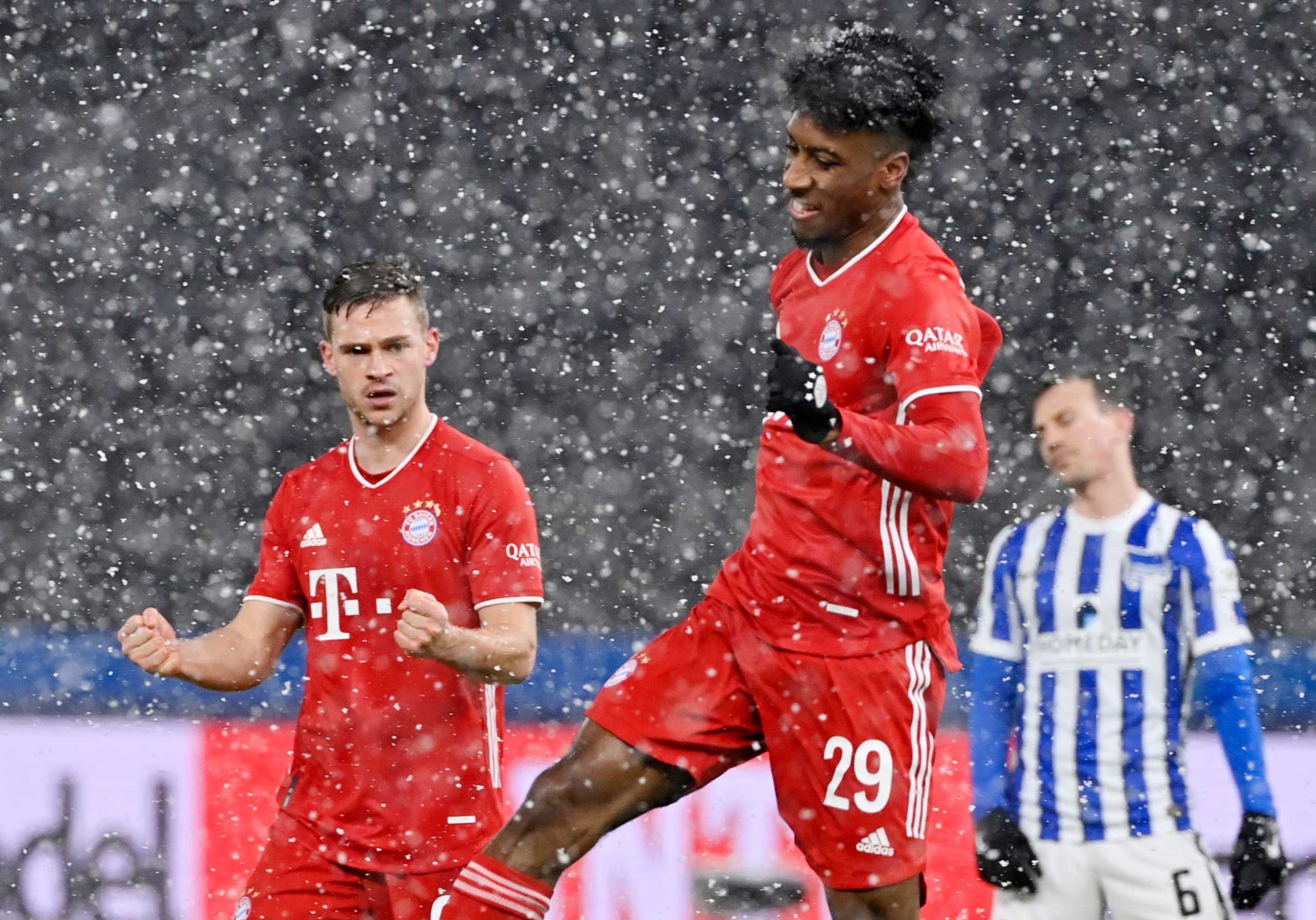 Soccer Football - Bundesliga - Hertha BSC v Bayern Munich - Olympiastadion, Berlin, Germany - February 5, 2021 Bayern Munich's Kingsley Coman celebrates scoring their first goal with Joshua Kimmich Pool via REUTERS