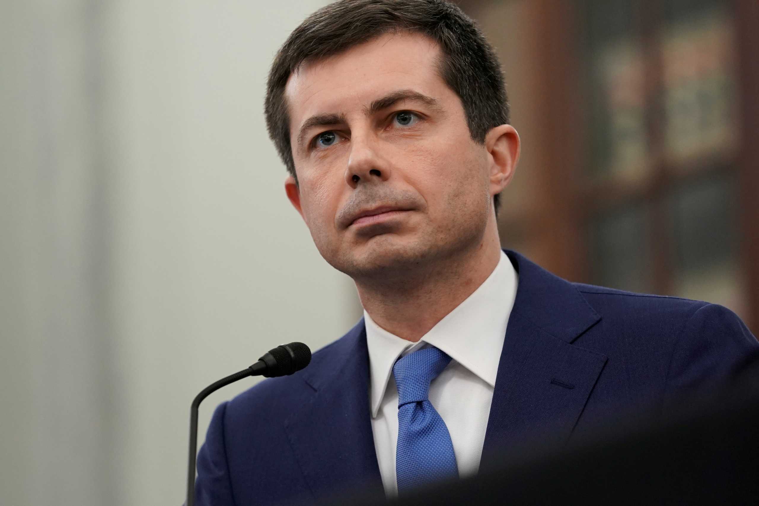 FILE PHOTO: Pete Buttigieg, U.S. secretary of transportation nominee for U.S. President Joe Biden, listens during a Senate Commerce, Science and Transportation Committee confirmation hearing in Washington, DC, U.S., January 21, 2021.  Stefani Reynolds