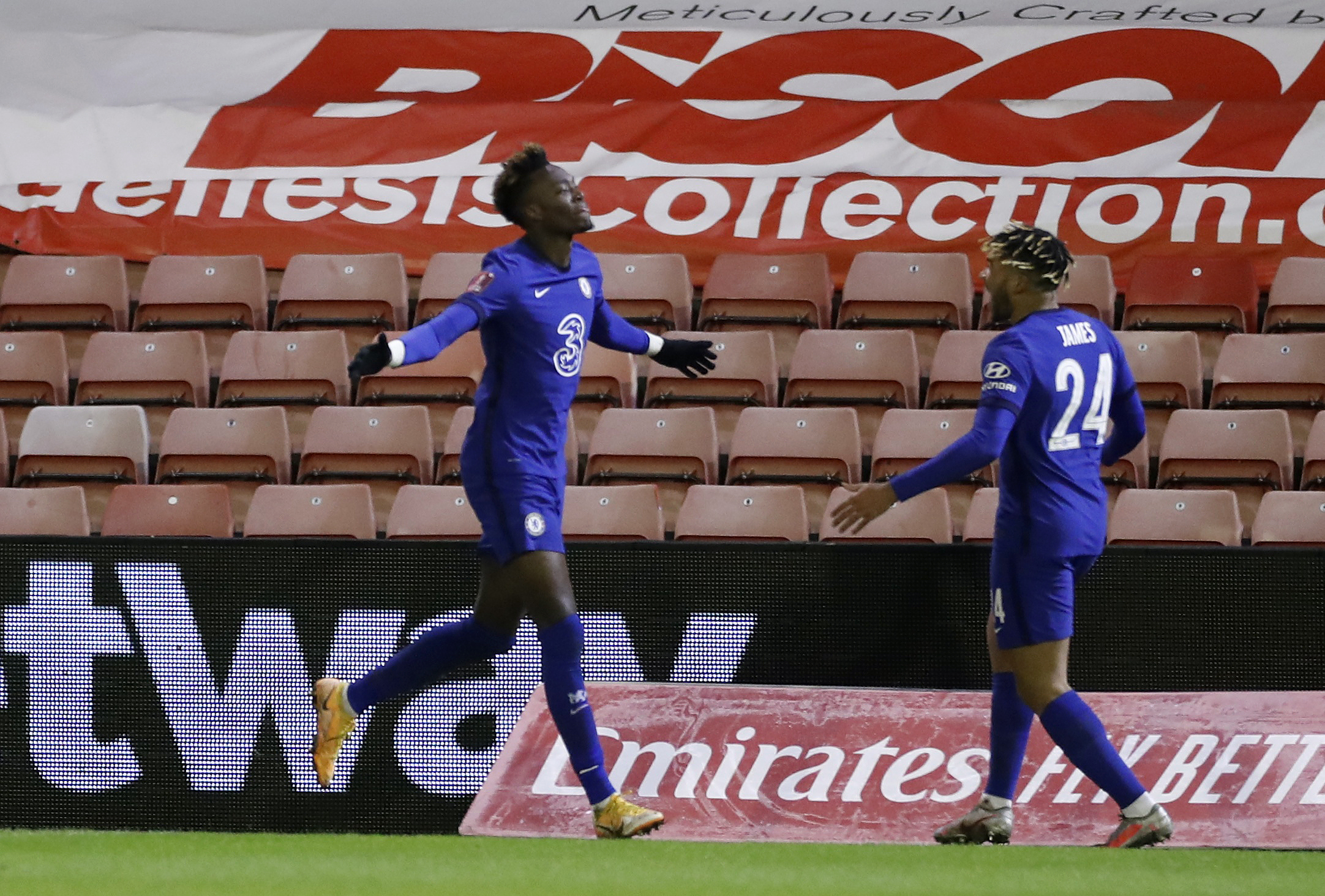 Soccer Football -  FA Cup - Fifth Round - Barnsley v Chelsea  - Oakwell, Barnsley, Britain - February 11, 2021 Chelsea's Tammy Abraham celebrates scoring their first goal with Reece James Action Images via Reuters