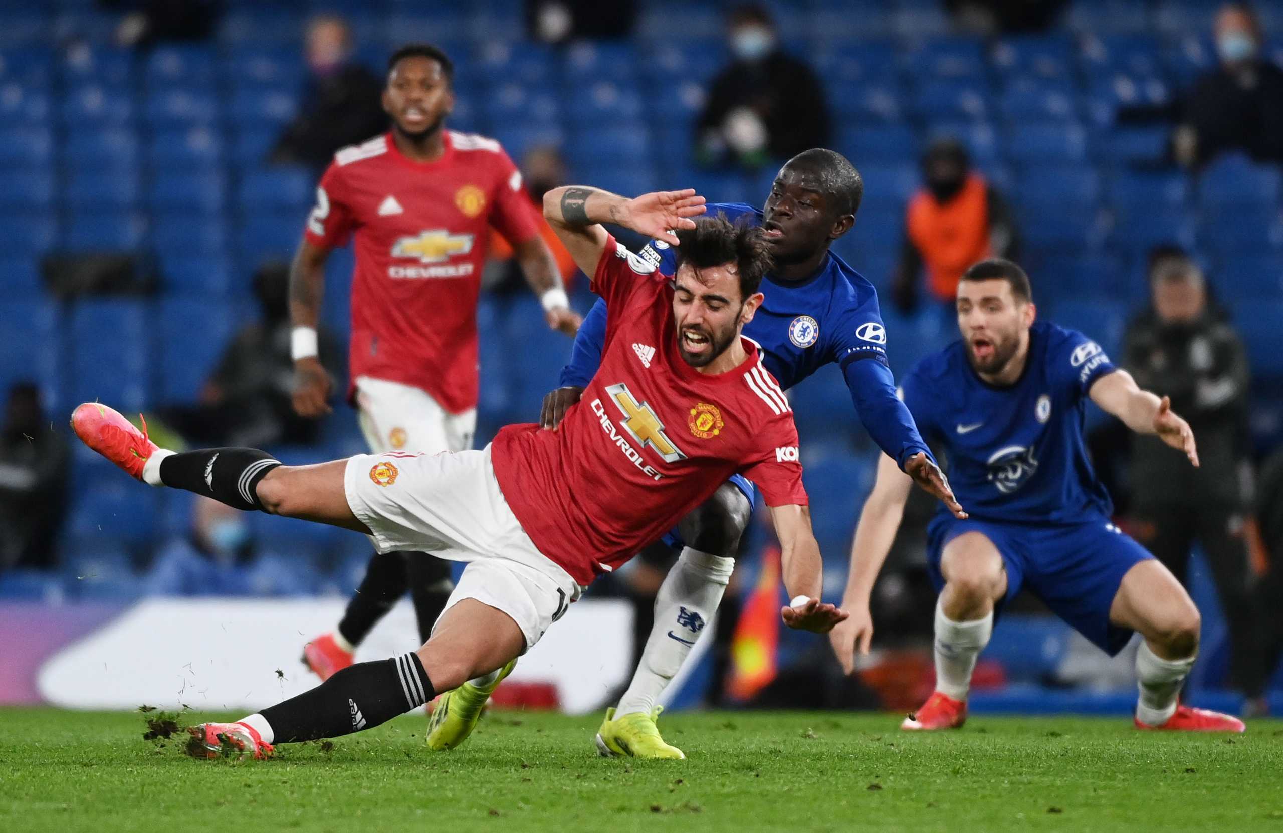 Soccer Football - Premier League - Chelsea v Manchester United - Stamford Bridge, London, Britain - February 28, 2021 Manchester United's Bruno Fernandes in action with Chelsea's N'Golo Kante Pool via REUTERS