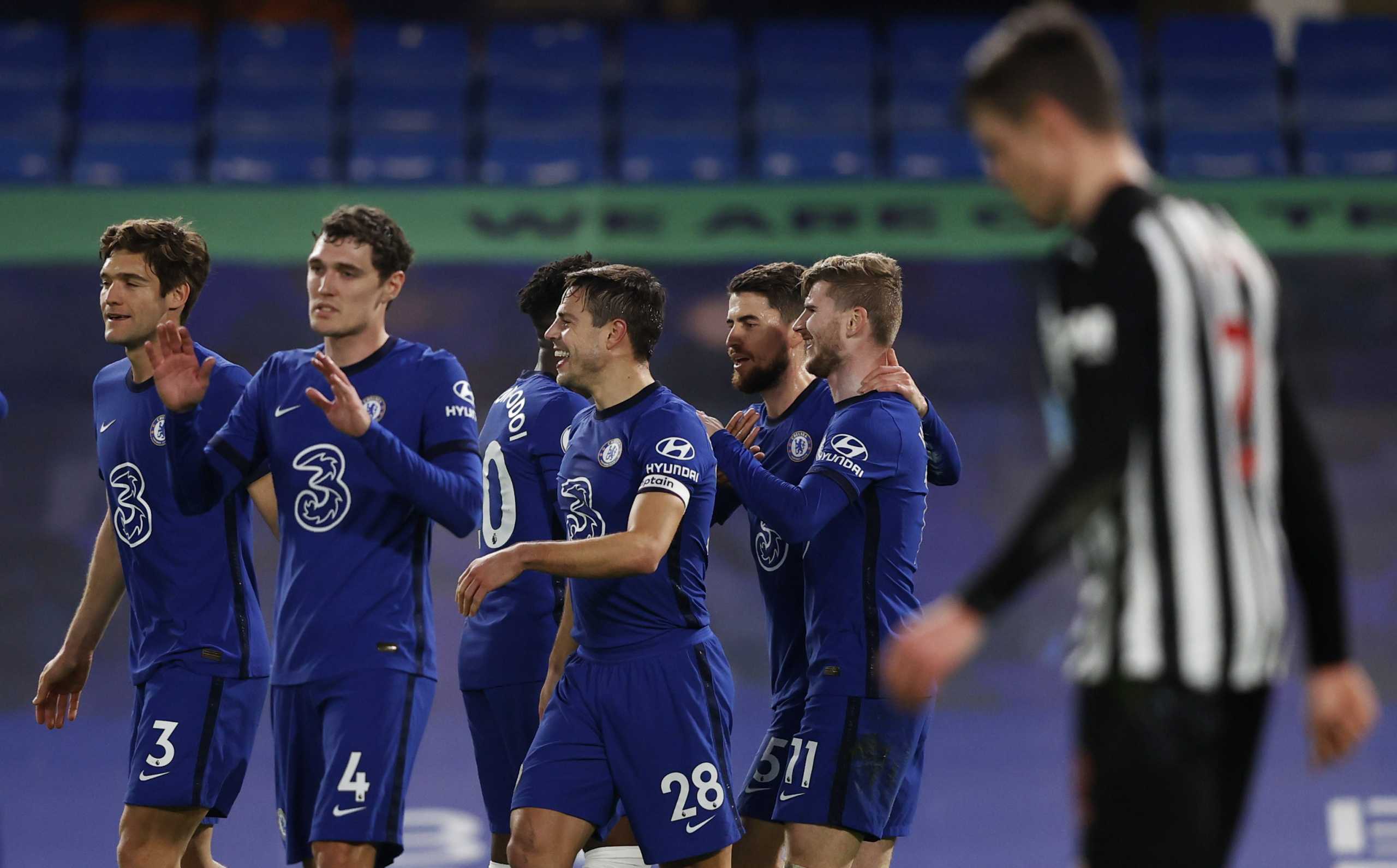 Soccer Football - Premier League - Chelsea v Newcastle United - Stamford Bridge, London, Britain - February 15, 2021 Chelsea's Timo Werner celebrates scoring their second goal with teammates Pool via REUTERS