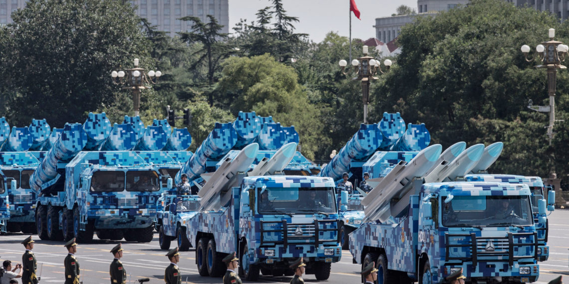 BEIJING, CHINA - SEPTEMBER 03:  Chinese missiles are seen on trucs as they drive towards Tiananmen Square and the Forbidden City during a military parade on September 3, 2015 in Beijing, China. China is marking the 70th anniversary of the end of World War II and its role in defeating Japan with a new national holiday and a military parade in Beijing.  (Photo by Kevin Frayer