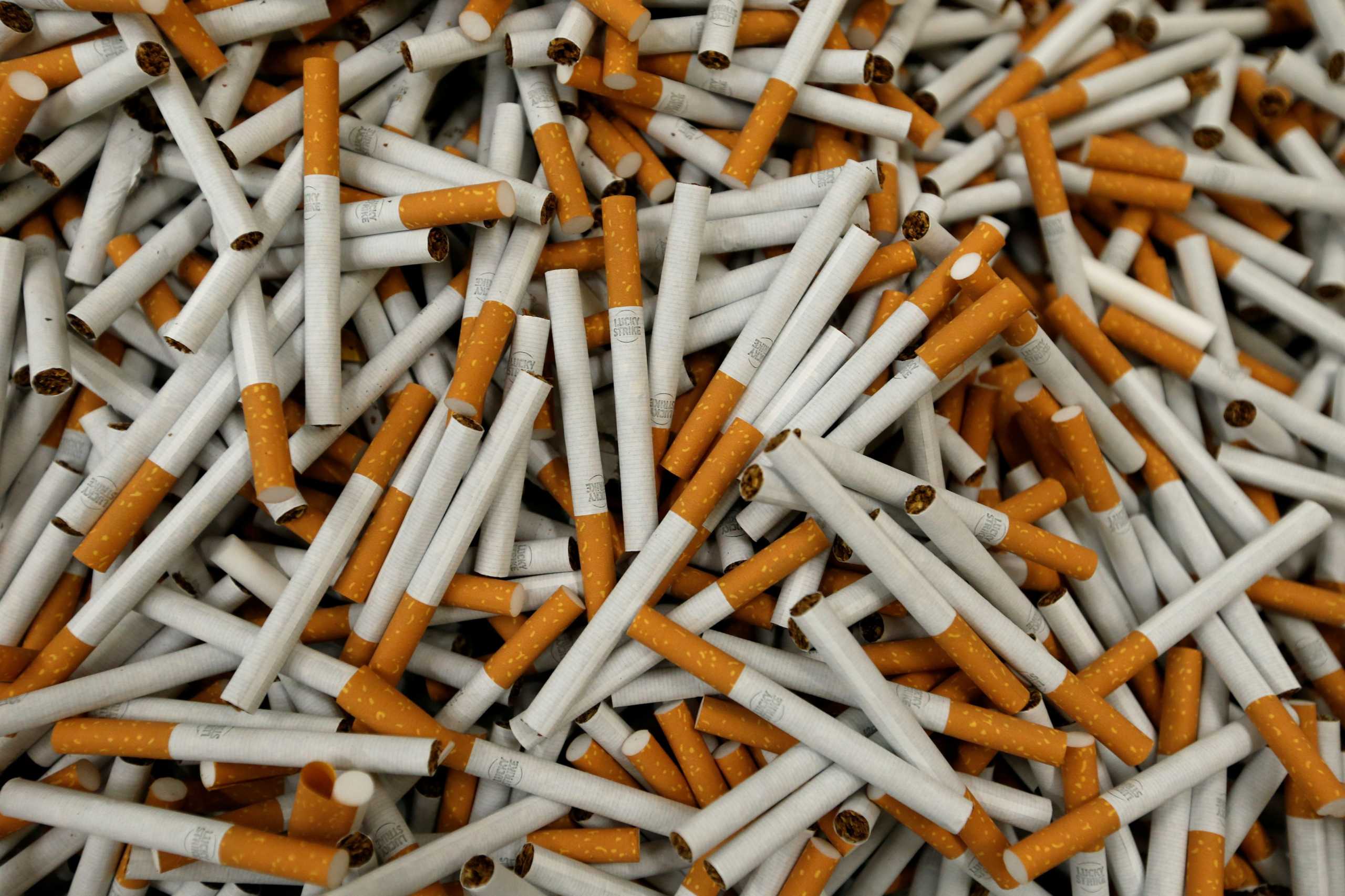 FILE PHOTO: Lucky Strike cigarettes are seen during the manufacturing process in the British American Tobacco Cigarette Factory (BAT) in Bayreuth, Germany, April 30, 2014. REUTERS