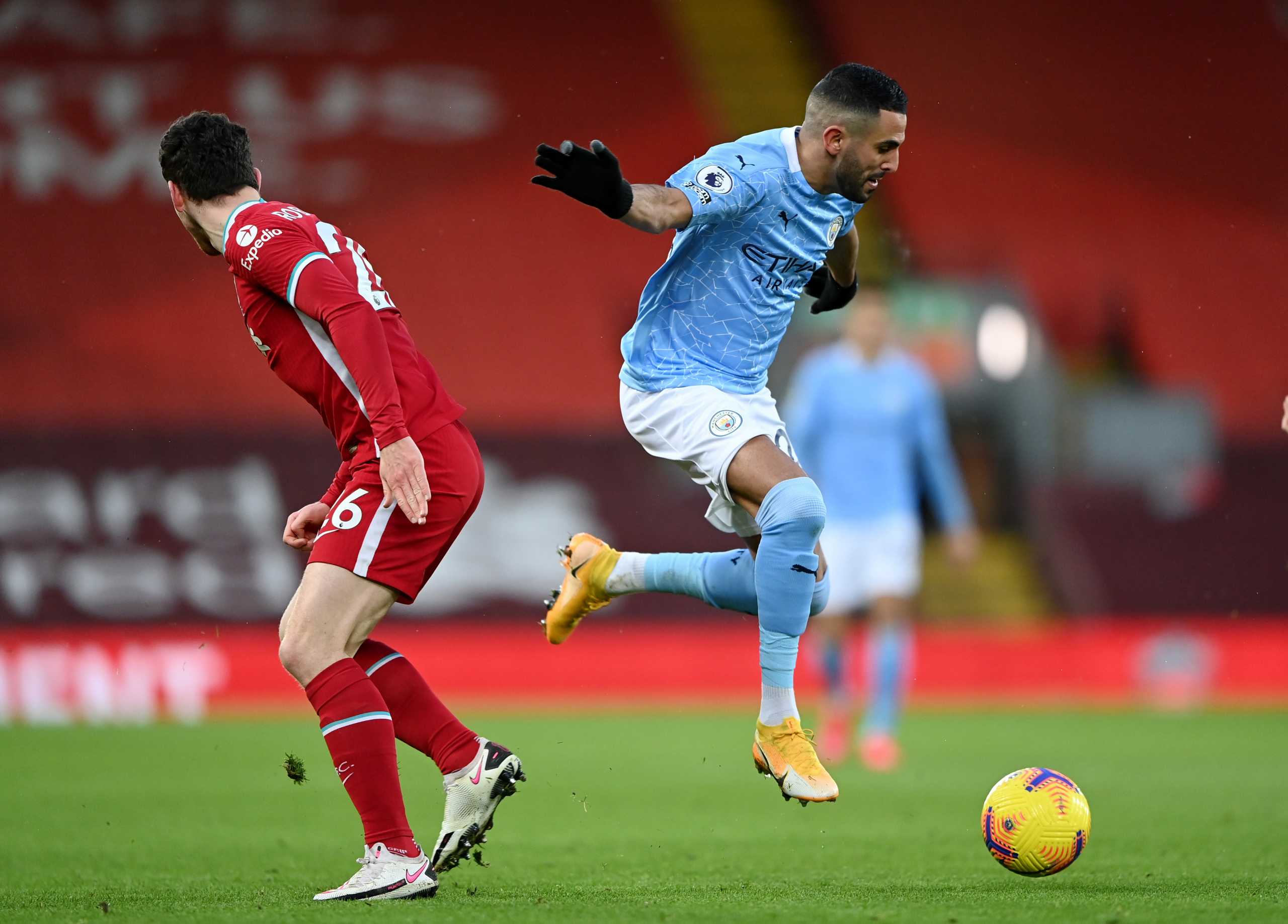 Soccer Football - Premier League - Liverpool v Manchester City - Anfield, Liverpool, Britain - February 7, 2021 Manchester City's Riyad Mahrez in action with Liverpool's Andrew Robertson Pool via REUTERS