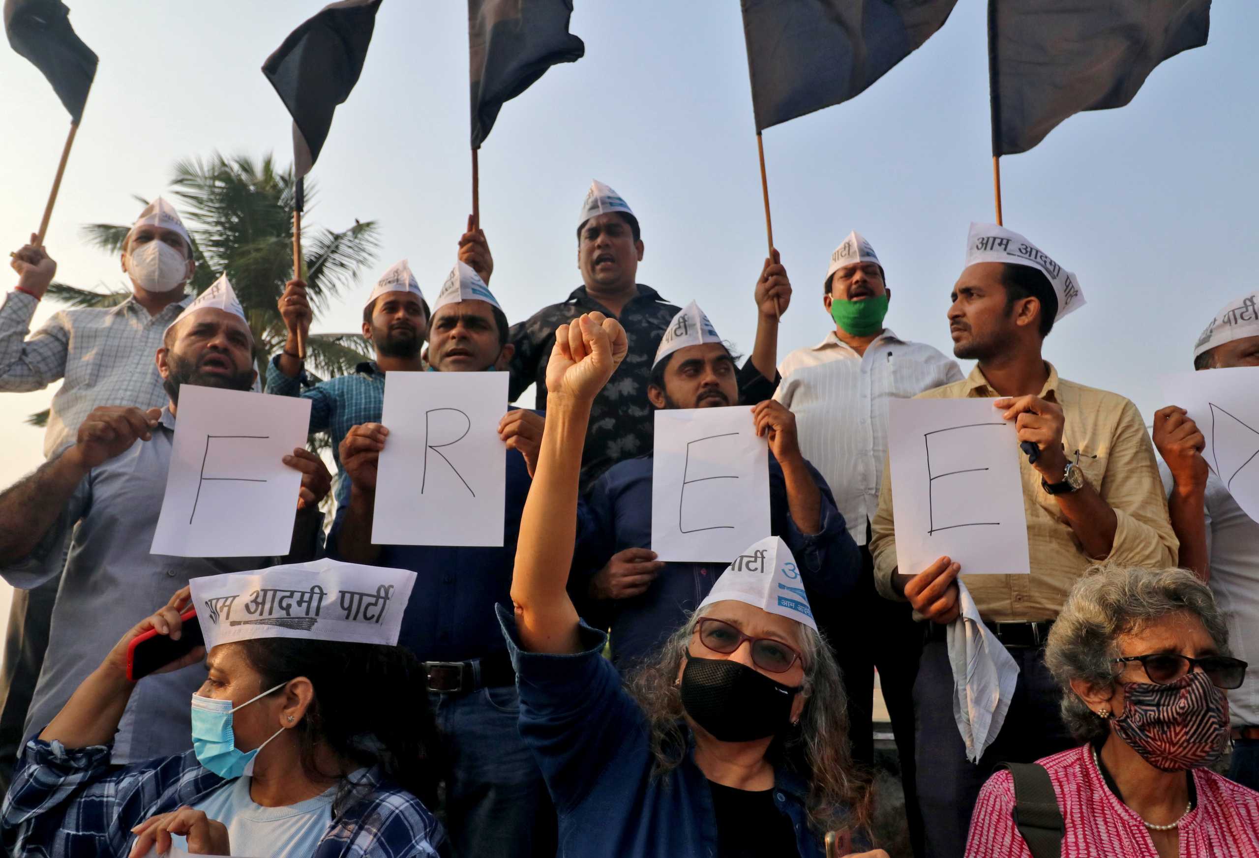 Supporters of Aam Aadmi Party (AAP) shout slogans during a protest against the arrest of 22-year-old climate activist Disha Ravi, in Mumbai, India, February 15, 2021. REUTERS