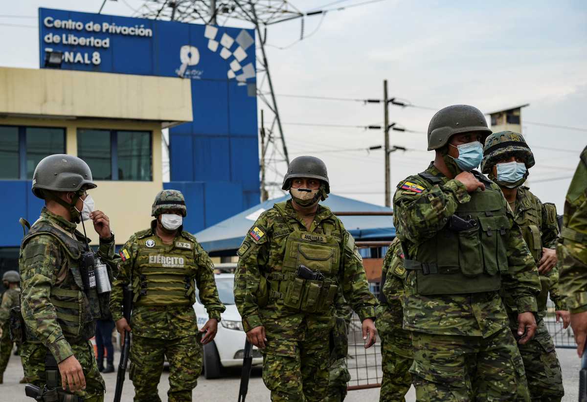 Soldier stand guard outside a prison where inmates were killed during a riot that the government described as a concerted action by criminal organisations, in Guayaquil, Ecuador February 23, 2021. REUTERS