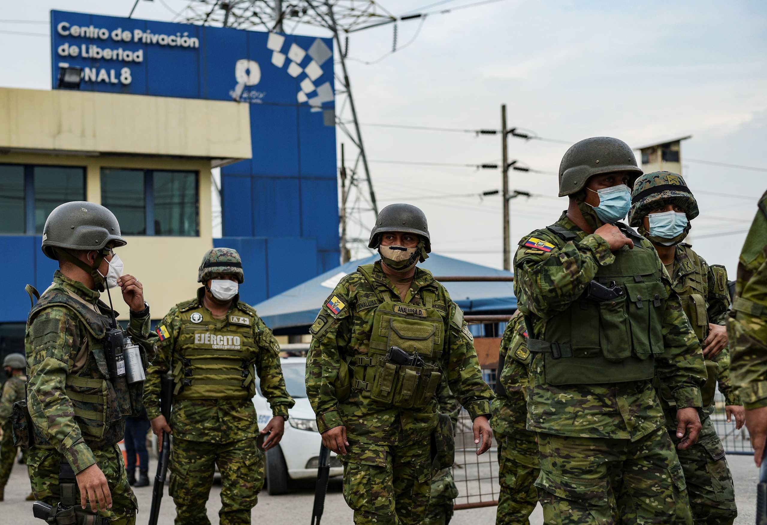 Soldier stand guard outside a prison where inmates were killed during a riot that the government described as a concerted action by criminal organisations, in Guayaquil, Ecuador February 23, 2021. REUTERS
