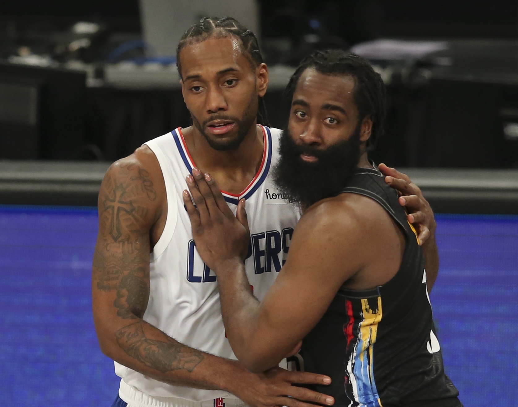 Feb 2, 2021; Brooklyn, New York, USA; Los Angeles Clippers small forward Kawhi Leonard (2) hugs Brooklyn Nets shooting guard James Harden (13) after their game at Barclays Center. Mandatory Credit: Brad Penner-USA TODAY Sports