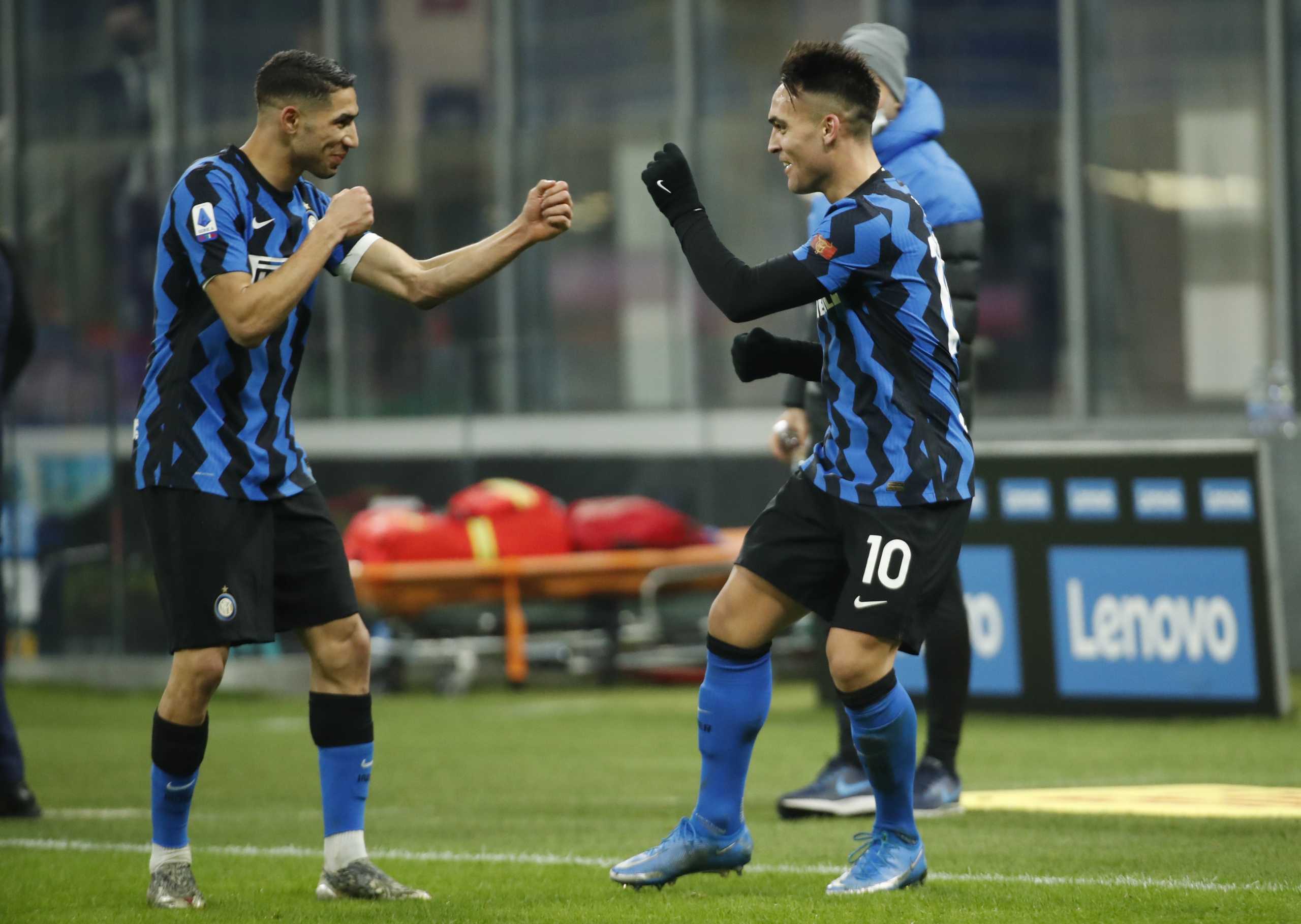 Soccer Football - Serie A - Inter Milan v Lazio - San Siro, Milan, Italy - February 14, 2021 Inter Milan's Lautaro Martinez celebrates scoring their third goal with Achraf Hakimi REUTERS