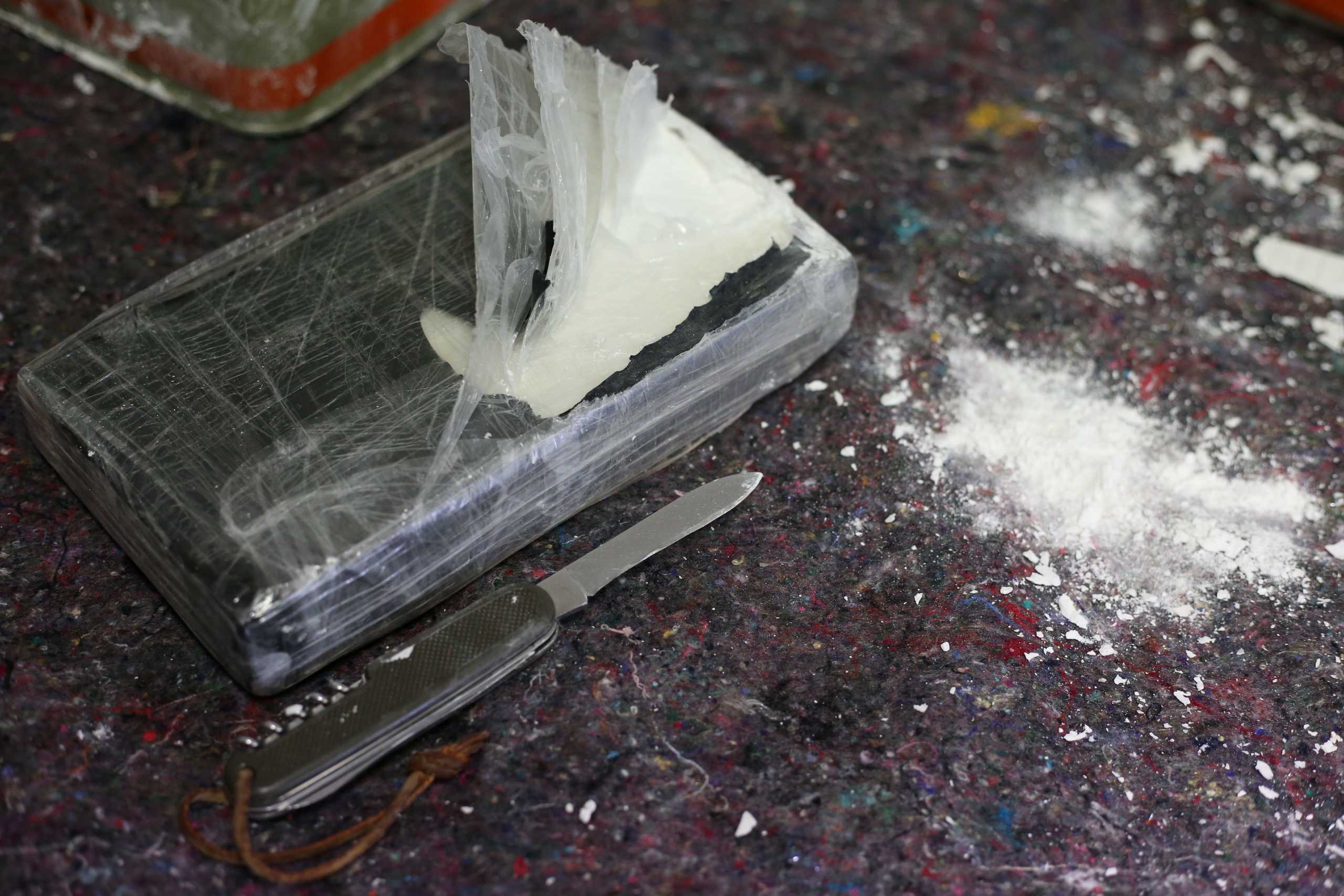 Zollfahndungsamt Hamburg shows a detail of cocaine, found in over 1,700 tins of wall filler, after German authorities seized more than 16 tonnes of cocaine in the northern port city of Hamburg, Germany, February 24, 2020, in Europe's largest cocaine haul to date. The Hamburg customs office said they had examined five suspicious shipping containers two weeks ago that came from Paraguay.  REUTERS