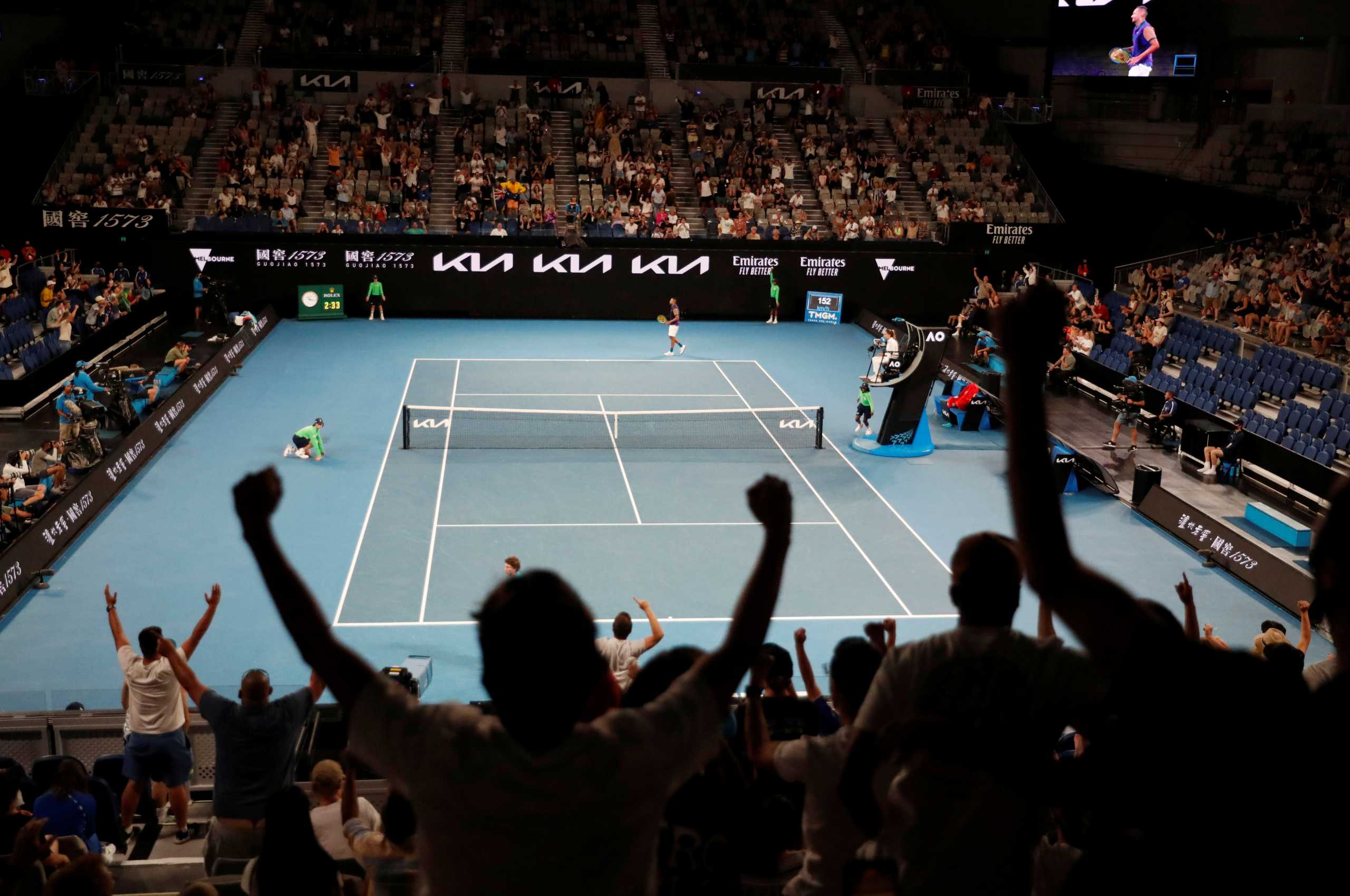 Tennis - Australian Open - Melbourne Park, Melbourne, Australia, February 10, 2021  Fans celebrate during the second round match between Australia's Nick Kyrgios and France's Ugo Humbert. Crowd capacity for this years event has been capped at 30,000 following the outbreak of the coronavirus disease (COVID-19) REUTERS