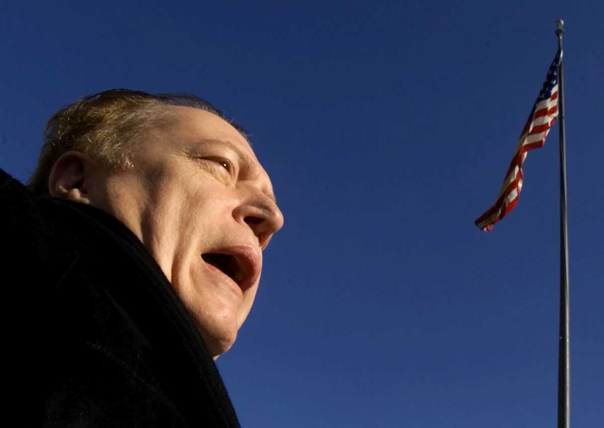 FILE PHOTO: Hustler magazine Publisher Larry Flynt speaks to members of the media outside U.S. District Court in Washington D.C. January 4, 2002.  REUTERS
