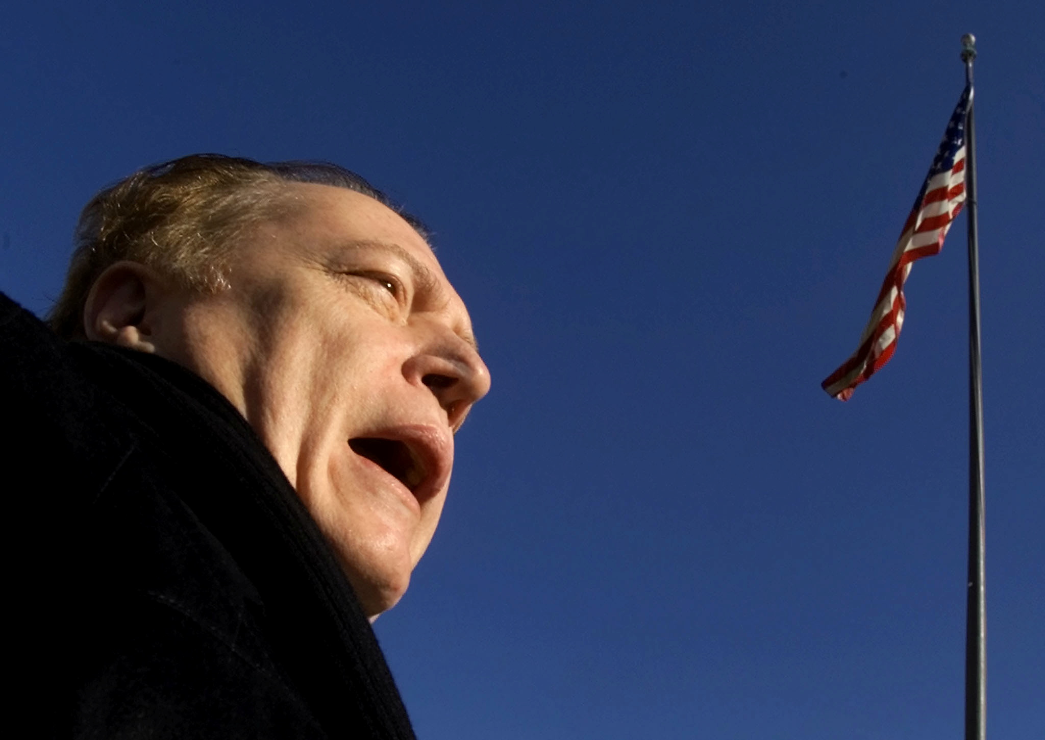 FILE PHOTO: Hustler magazine Publisher Larry Flynt speaks to members of the media outside U.S. District Court in Washington D.C. January 4, 2002.  REUTERS