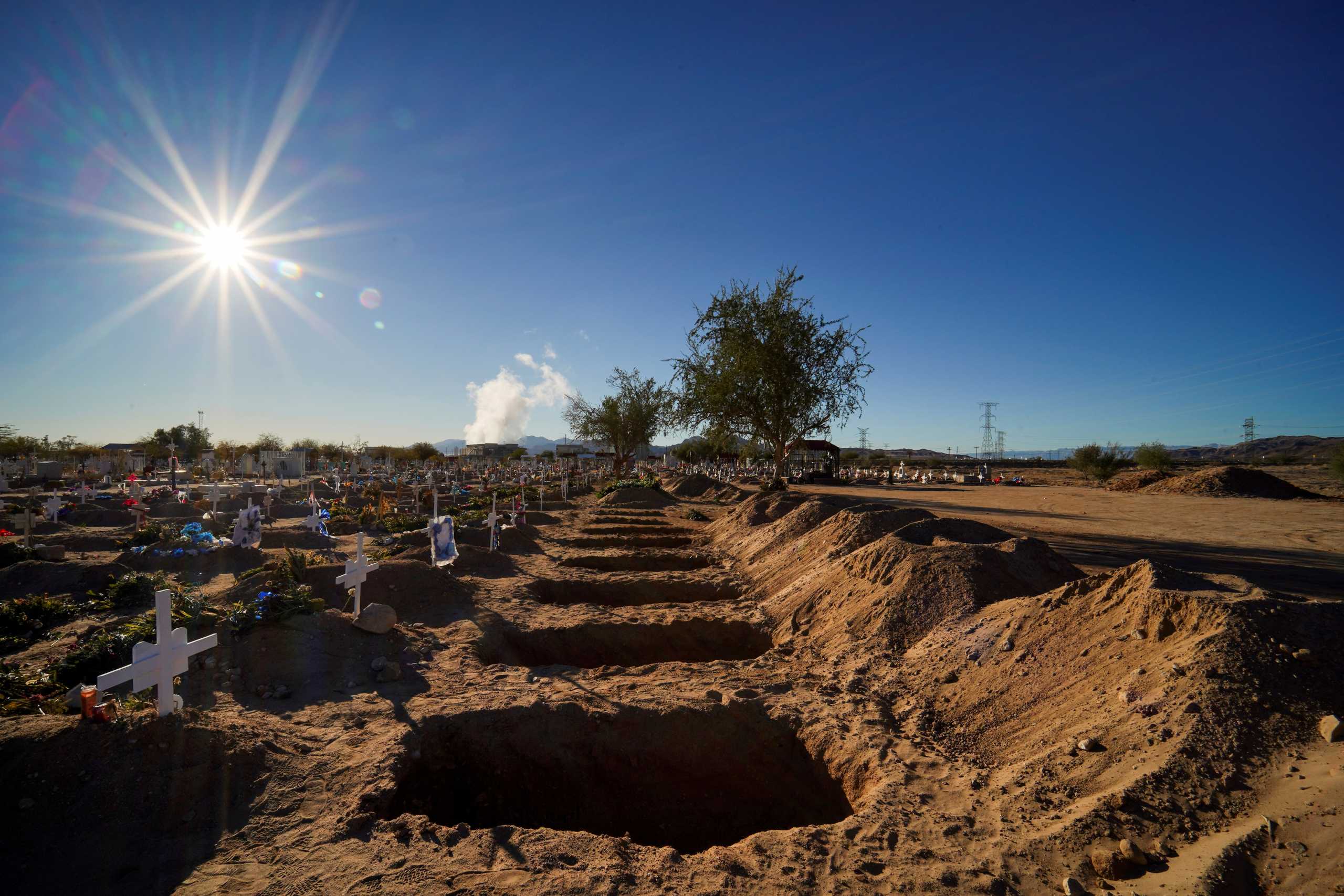 Freshly dug graves are pictured at the El Centinela cemetery, amid the coronavirus disease (COVID-19) pandemic, in Mexicali, Baja California state, Mexico January 30, 2021. REUTERS