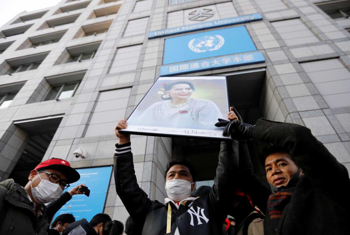Protesters from Myanmar residing in Japan hold a portrait of leader Aung San Suu Kyi at a rally against Myanmar's military after it seized power from a democratically elected civilian government and arrested Suu Kyi, at United Nations University in Tokyo, Japan February 1, 2021. REUTERS