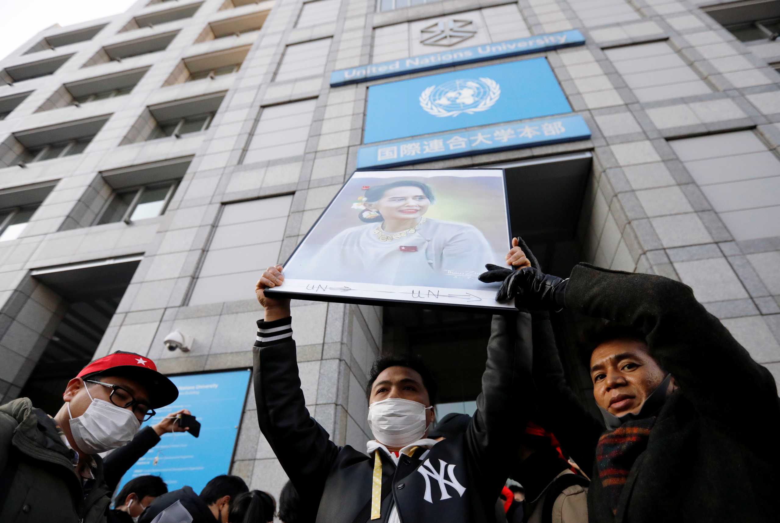 Protesters from Myanmar residing in Japan hold a portrait of leader Aung San Suu Kyi at a rally against Myanmar's military after it seized power from a democratically elected civilian government and arrested Suu Kyi, at United Nations University in Tokyo, Japan February 1, 2021. REUTERS