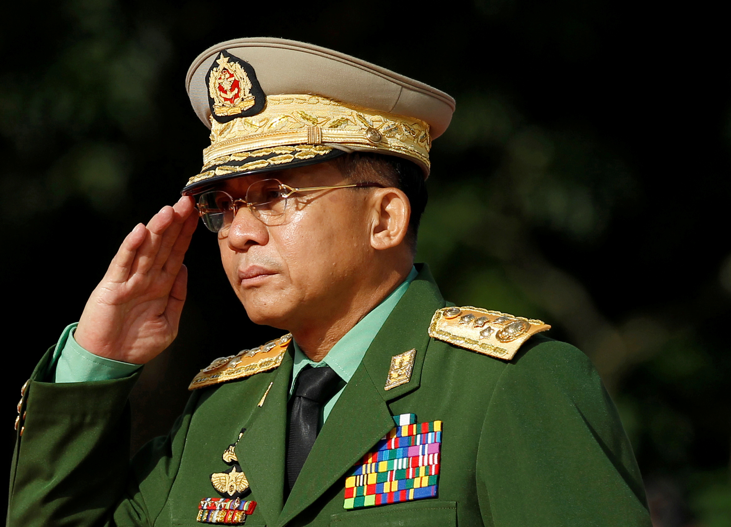 FILE PHOTO: Myanmar Commander in Chief Senior General Min Aung Hlaing salutes as he attends an event marking the anniversary of Martyrs' Day at the Martyrs' Mausoleum in Yangon July 19, 2016. REUTERS