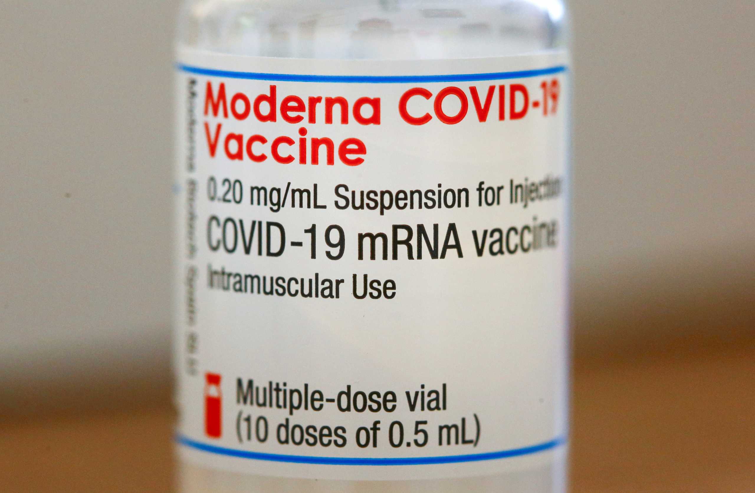 A bottle containing multiple doses of the Moderna COVID-19 vaccine is pictured at the Hausaerzte Hegibachplatz doctors office as the spread of the coronavirus disease (COVID-19) continues, in Zurich, Switzerland January 28, 2021. REUTERS