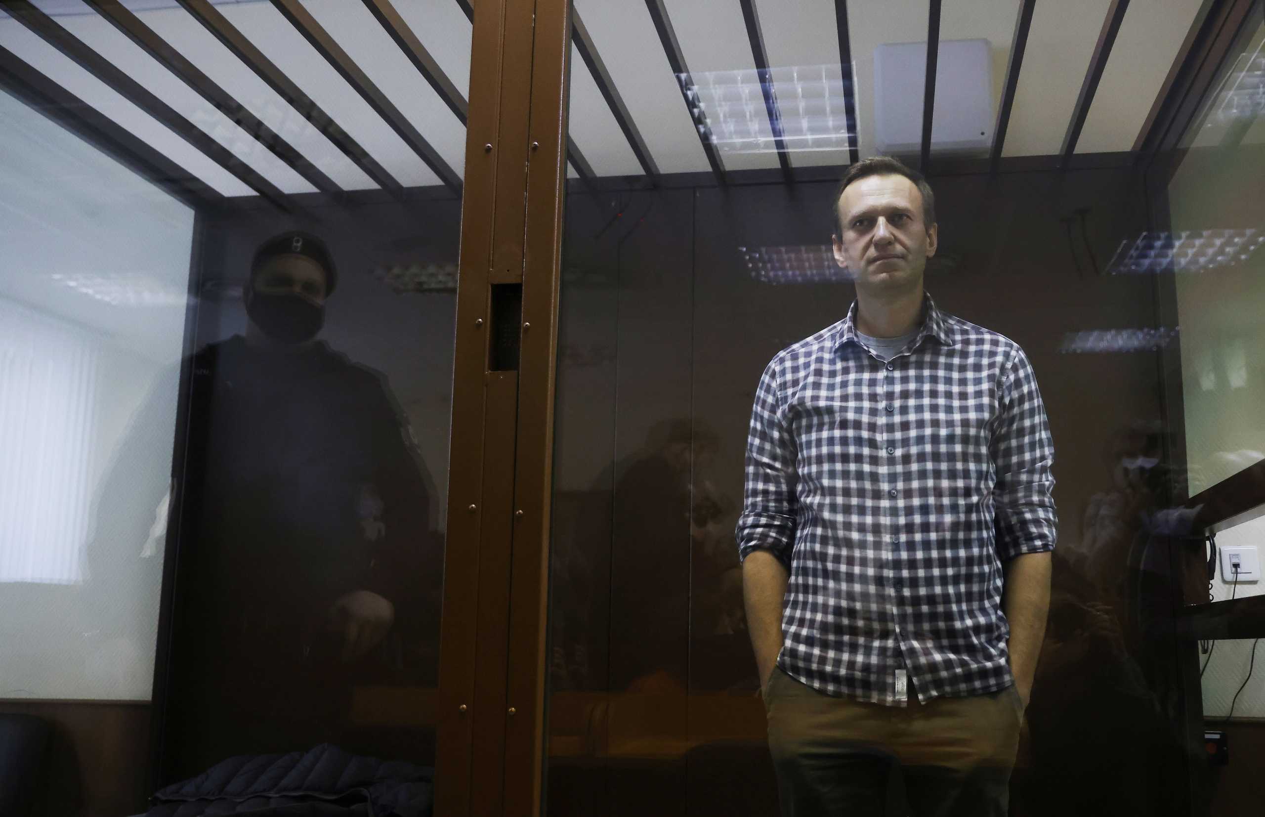 Russian opposition leader Alexei Navalny attends a hearing to consider an appeal against an earlier court decision to change his suspended sentence to a real prison term, in Moscow, Russia February 20, 2021. REUTERS