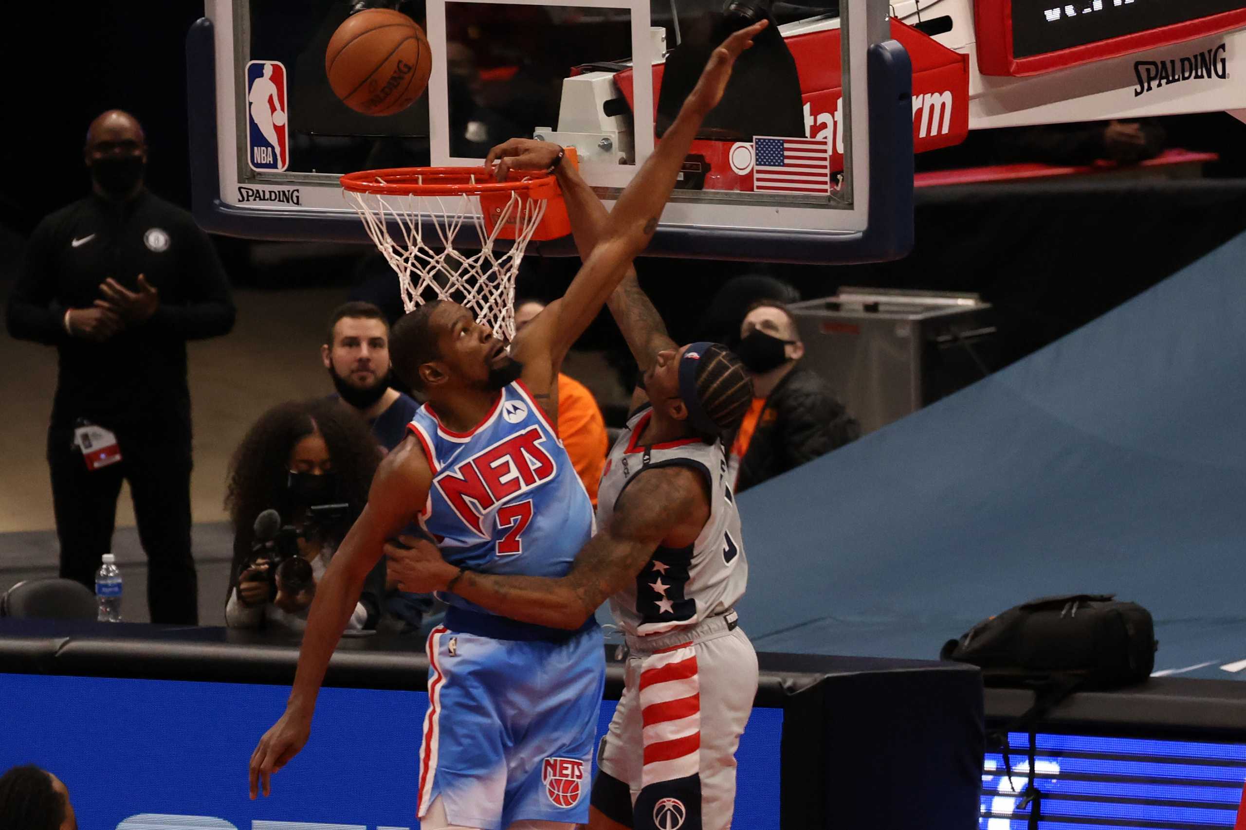 Jan 31, 2021; Washington, District of Columbia, USA; Brooklyn Nets forward Kevin Durant (7) blocks a dunk attempt by Washington Wizards guard Bradley Beal (3) in the fourth quarter at Capital One Arena. Mandatory Credit: Geoff Burke-USA TODAY Sports