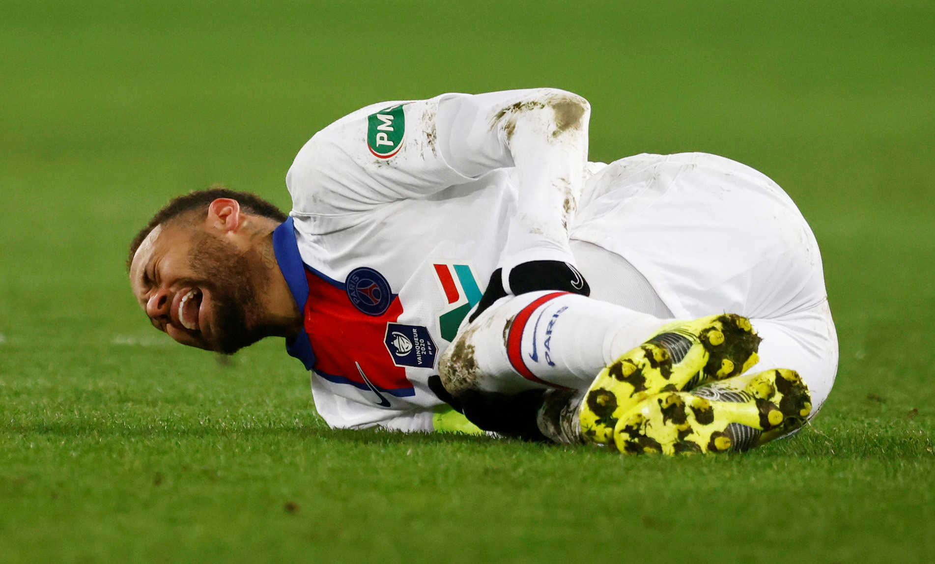 FILE PHOTO: Soccer Football - French Cup - Round of 64 - Caen v Paris St Germain - Stade Michel d'Ornano, Caen, France - February 10, 2021 Paris St Germain's Neymar reacts after sustaining an injury REUTERS