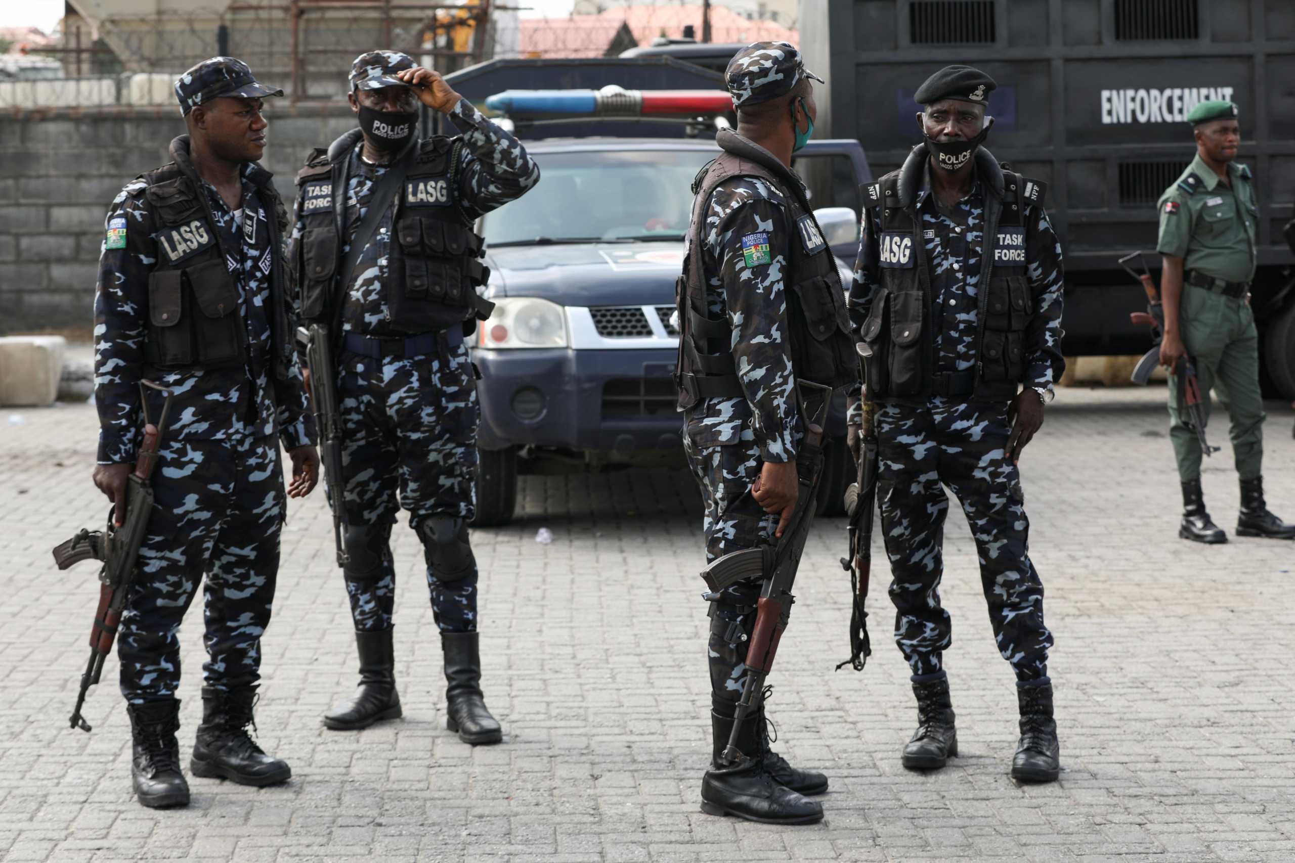 Security forces guard the area during a protest against the reopening of the Lekki Toll Gate in Lagos, Nigeria, February 13, 2021. REUTERS