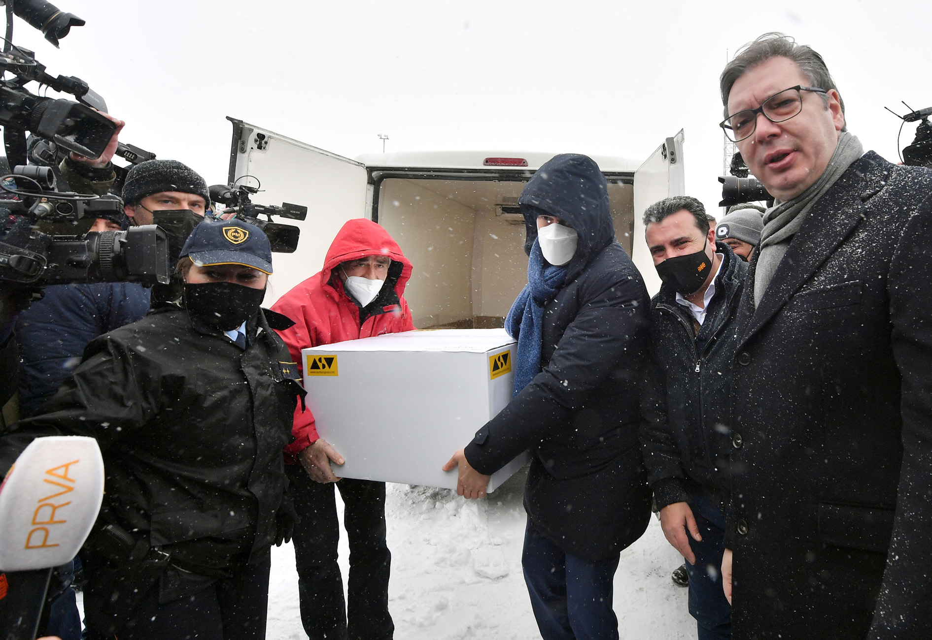 Macedonian Prime Minister Zoran Zaev welcomes Serbian President Aleksandar Vucic to receive?a coronavirus disease (COVID-19) vaccine donation at the?border crossing with Serbia in Tabonovce, North Macedonia,  February 14, 2021. REUTERS