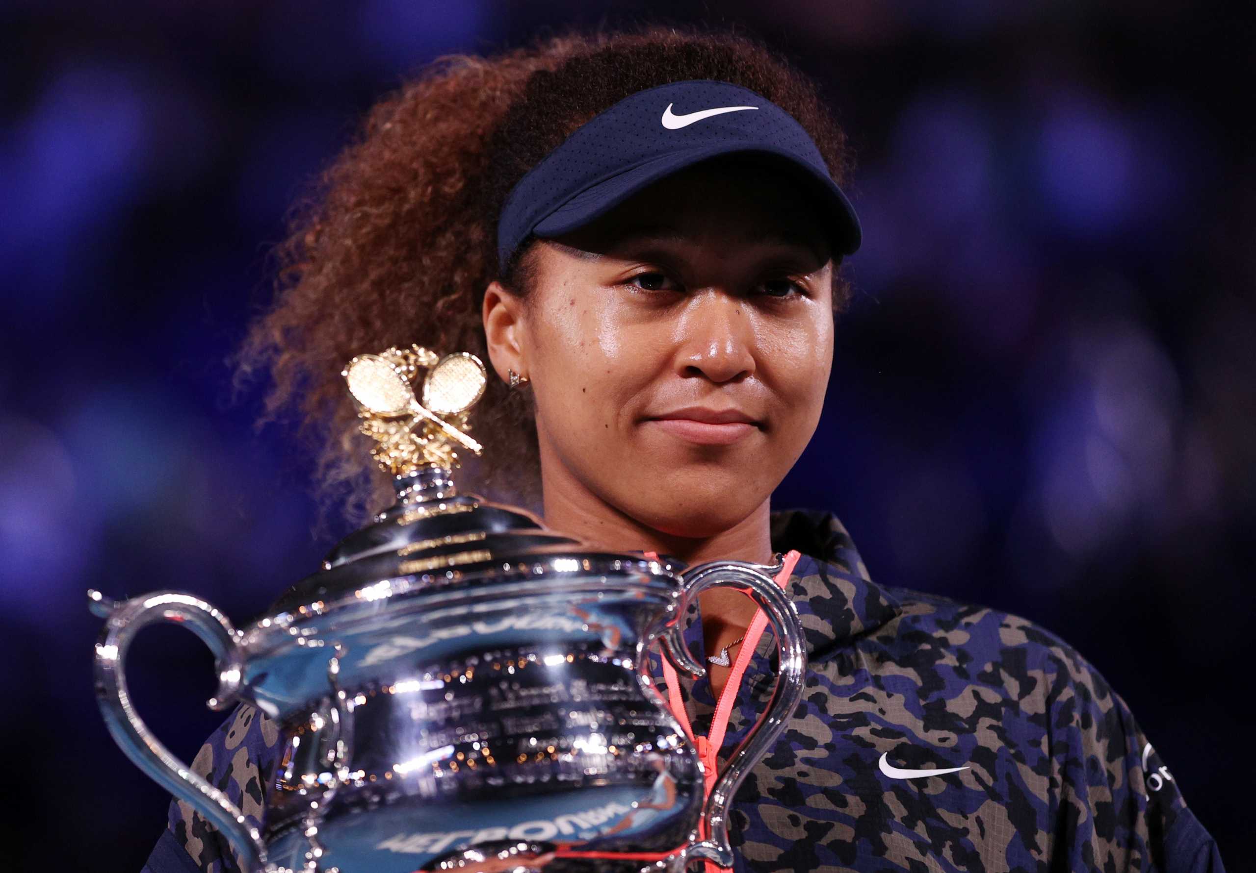 Tennis - Australian Open - Women's Singles Final - Melbourne Park, Melbourne, Australia, February 20, 2021 Japan's Naomi Osaka poses with the trophy after winning her final match against Jennifer Brady of the U.S. REUTERS