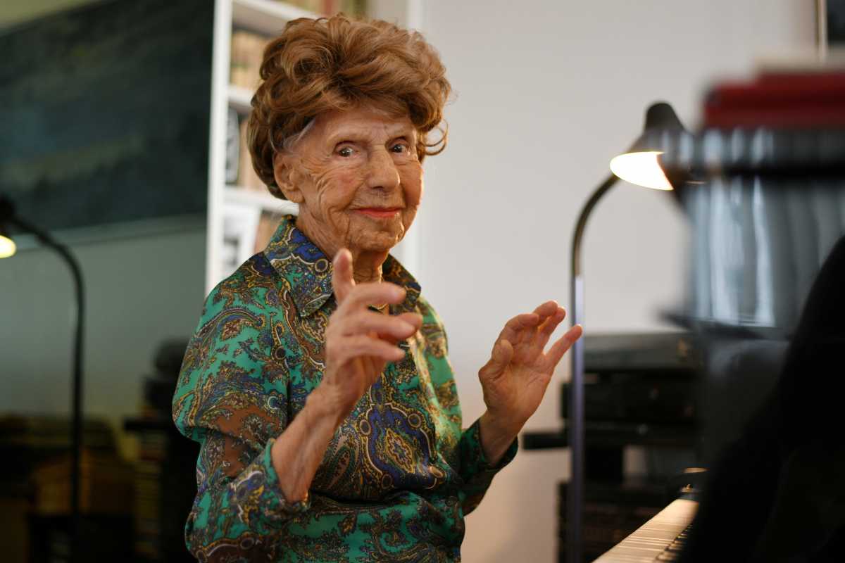 Parisian pianist Colette Maze, 106 years old, poses at her home in Paris, France, February 4, 2021. Maze has been playing the piano since the age of 4, almost one century ago. Today, she is working on yet another album, as performing on the piano remains a way for her to fill an emotional void and feed her imagination. Picture taken February 4, 2021. REUTERS
