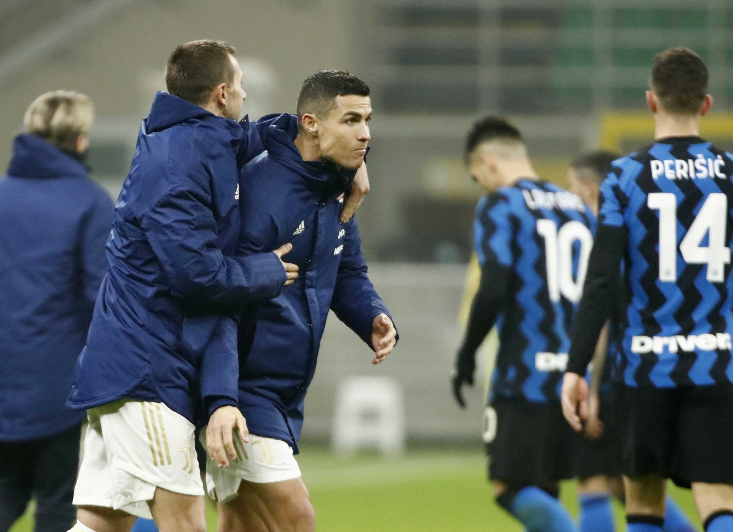 Soccer Football - Coppa Italia – Semi Final - First Leg - Inter Milan v Juventus - San Siro, Milan, Italy - February 2, 2021 Juventus' Cristiano Ronaldo and Federico Bernardeschi celebrate after the match REUTERS