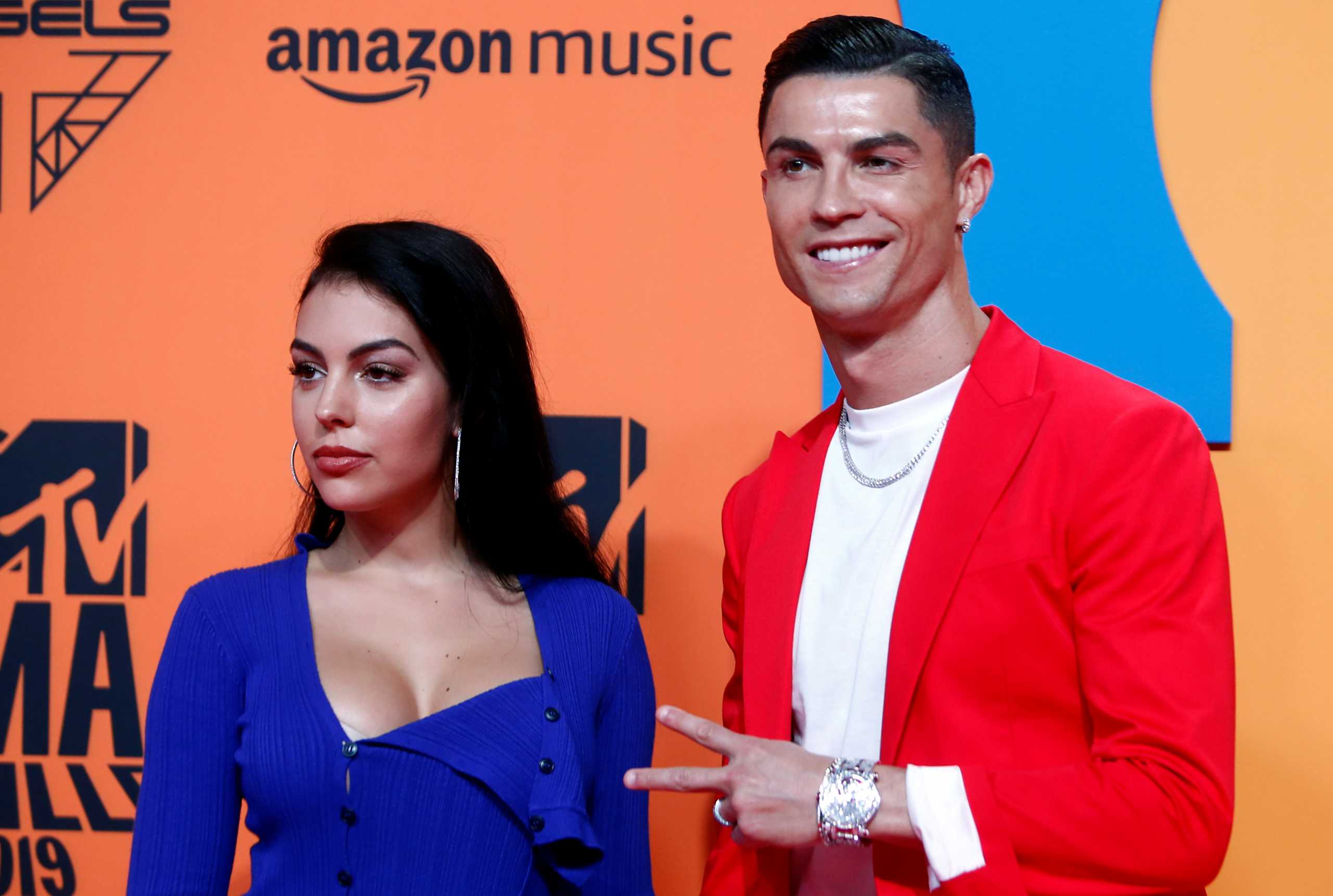 FILE PHOTO: Cristiano Ronaldo and Georgina Rodriguez pose on a red carpet as they arrive at the 2019 MTV Europe Music Awards at the FIBES Conference and Exhibition Centre in Seville, Spain, November 3, 2019. REUTERS
