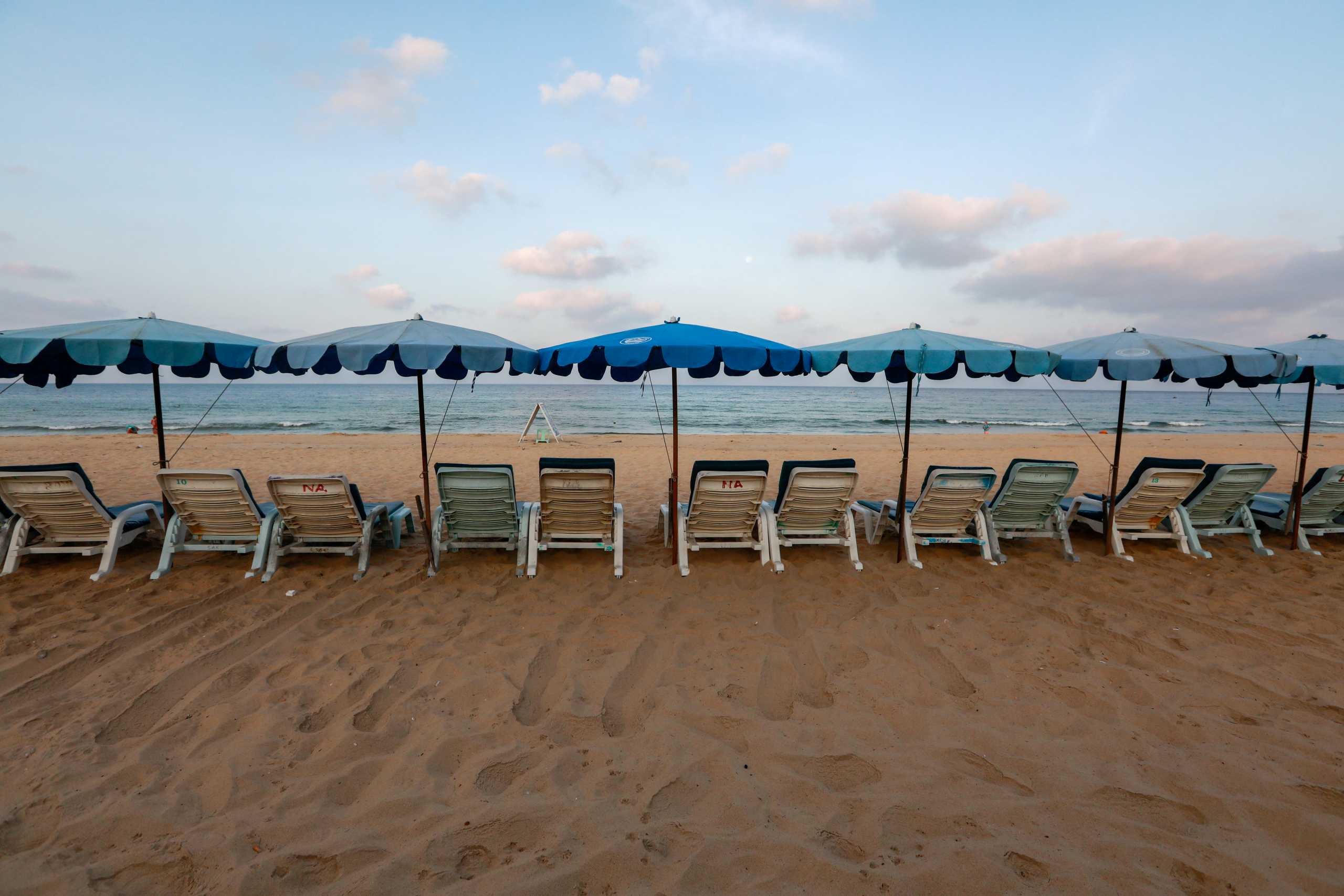 FILE PHOTO: Empty chairs are seen on a beach which is usually full of tourists, amid fear of coronavirus in Phuket, Thailand March 11, 2020. REUTERS