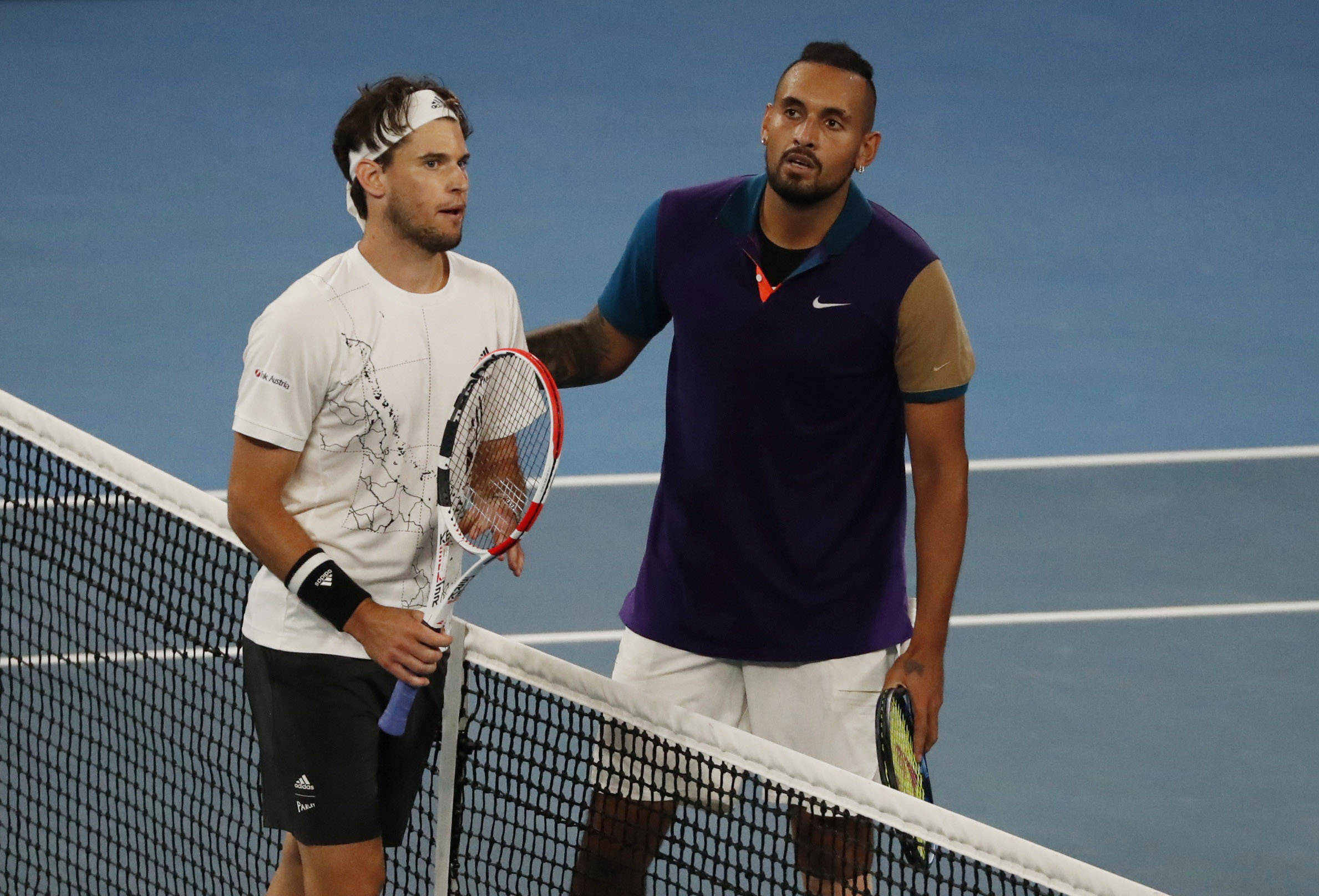 Tennis - Australian Open - Melbourne Park, Melbourne, Australia, February 12, 2021 Austria's Dominic Thiem with Australia's Nick Kyrgios after winning their third round match REUTERS