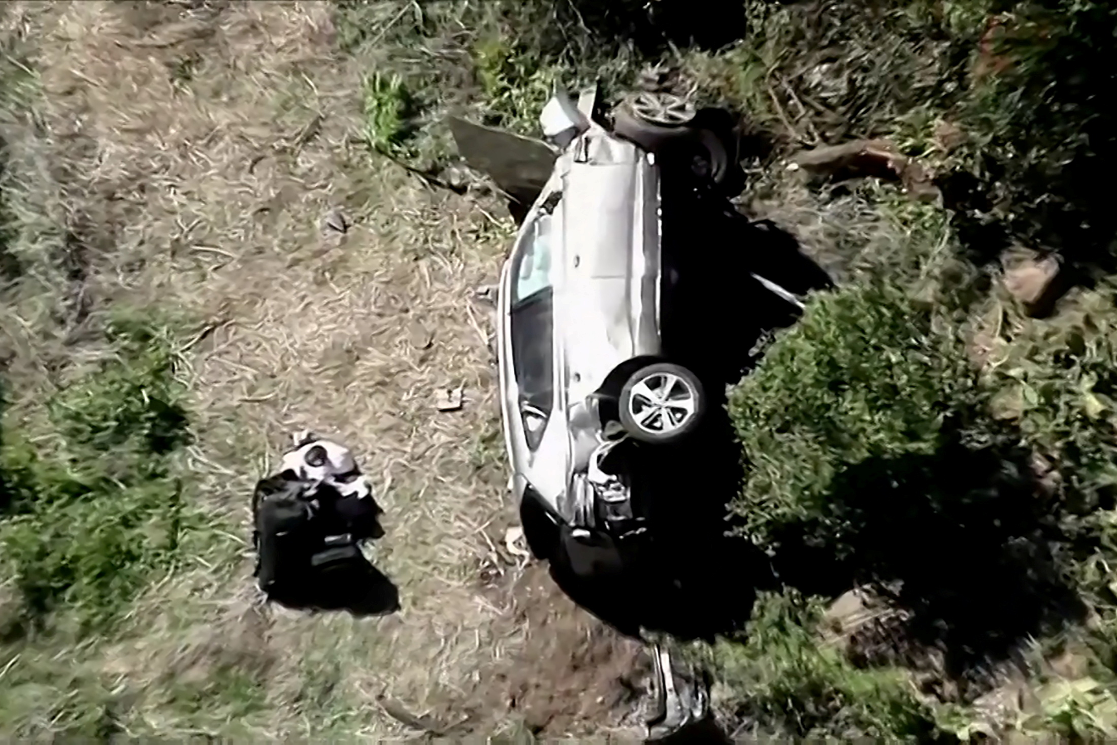 The vehicle of golfer Tiger Woods, who was rushed to hospital after suffering multiple injuries, lies on its side after being involved in a single-vehicle accident in Los Angeles, California, U.S. in a still image from video taken February 23, 2021. KNBC via REUTERS NO RESALES. NO ARCHIVES. MANDATORY CREDIT. THIS IMAGE HAS BEEN SUPPLIED BY A THIRD PARTY.     TPX IMAGES OF THE DAY