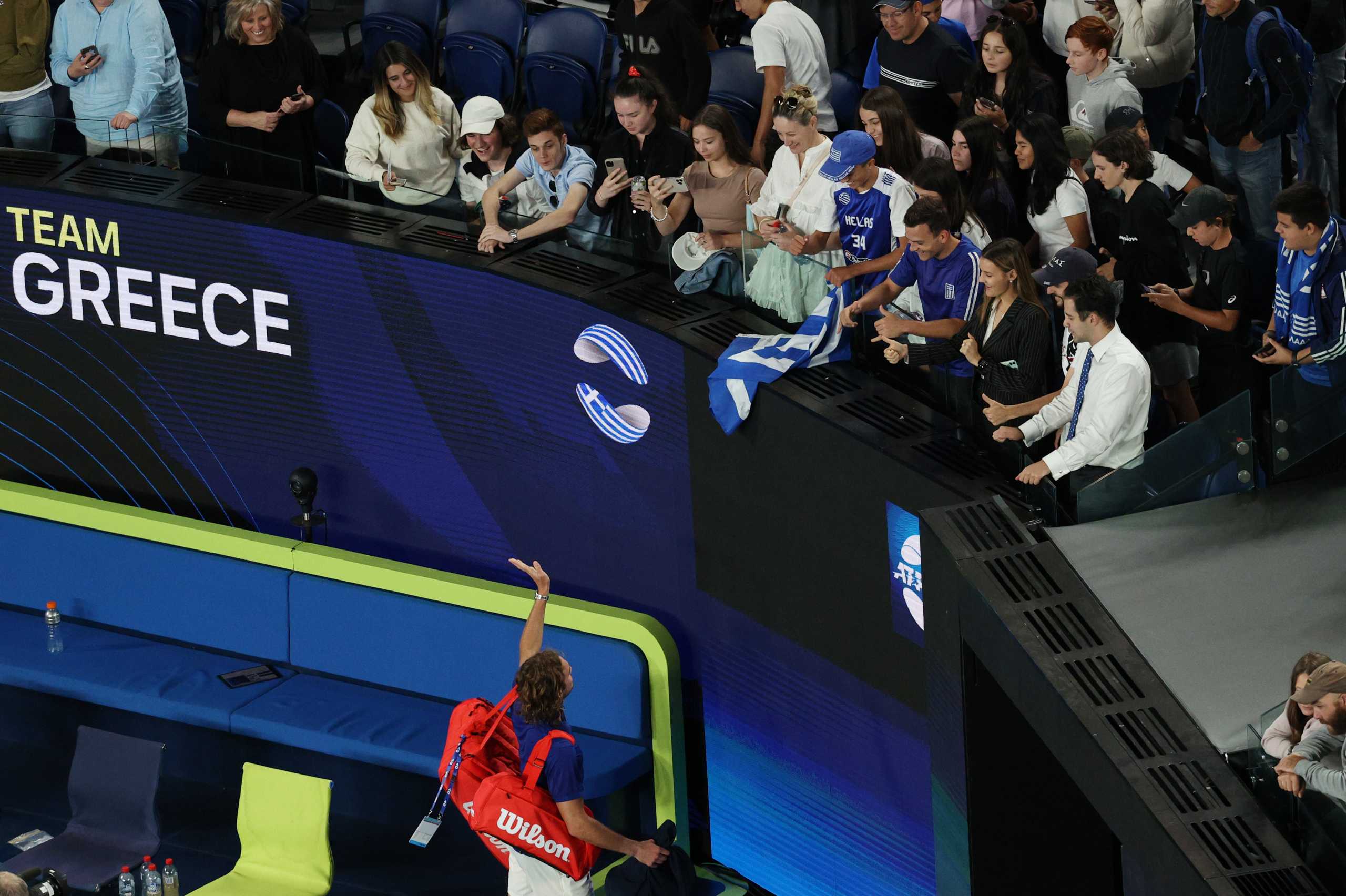 Tennis - ATP Cup - Melbourne Park, Melbourne, Australia - February 3, 2021 Greece's Stefanos Tsitsipas waves to fans after winning his ground stage match against Australia's Alex de Minaur REUTERS
